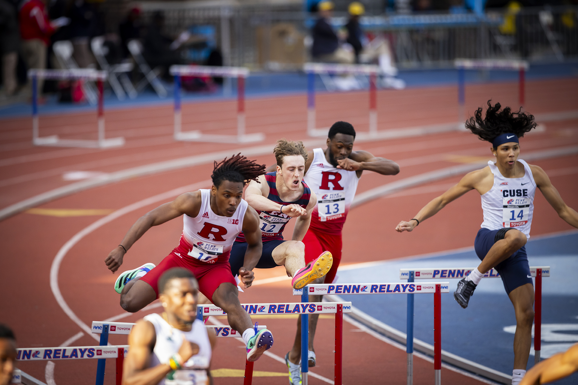 student athletes compete in hurdles at the penn relays