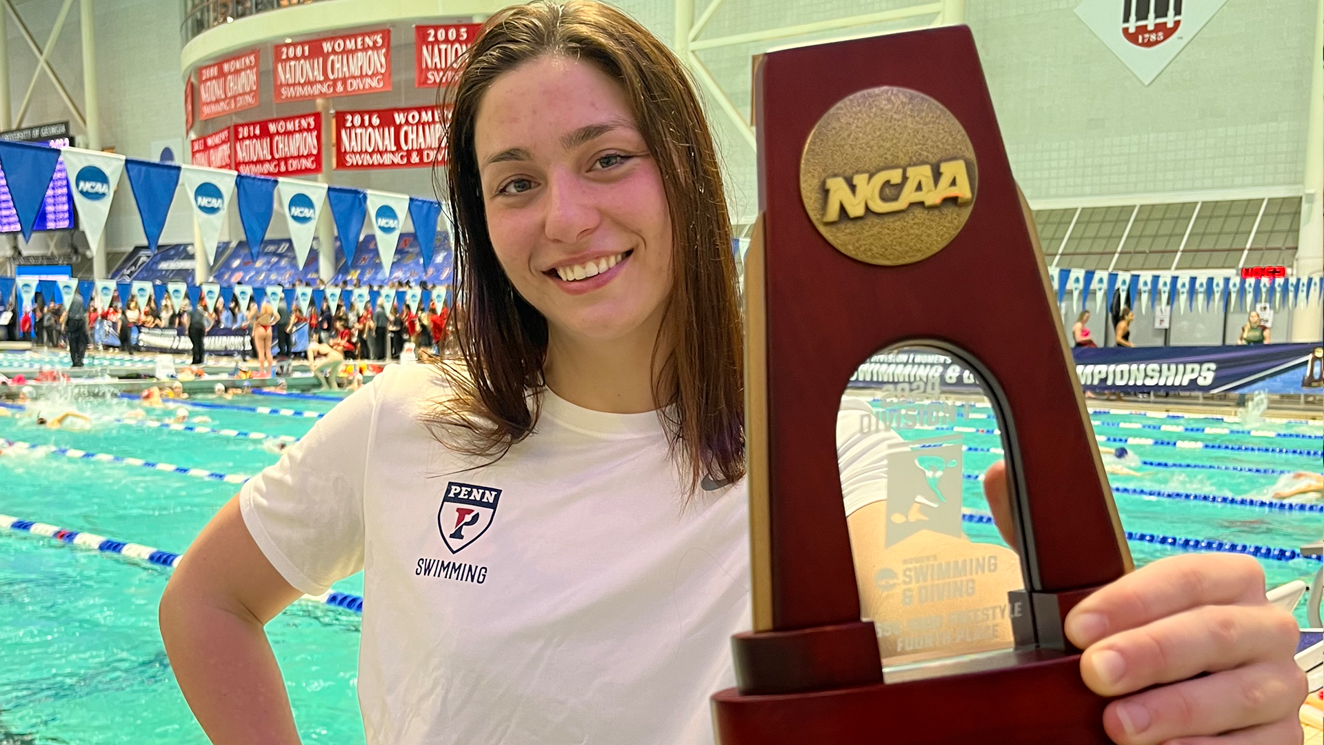 Anna Kalandadze holds up her fourth-place NCAA trophy after the NCAA Championships.