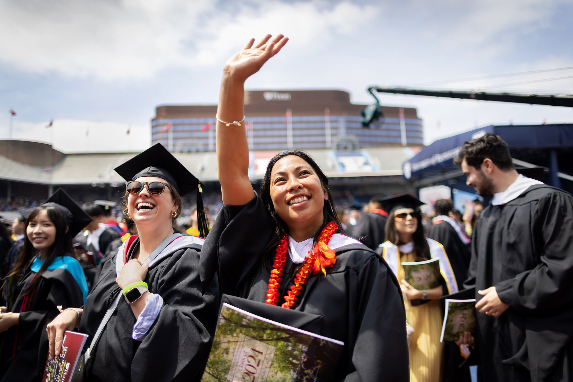 student waves during the commencement ceremony
