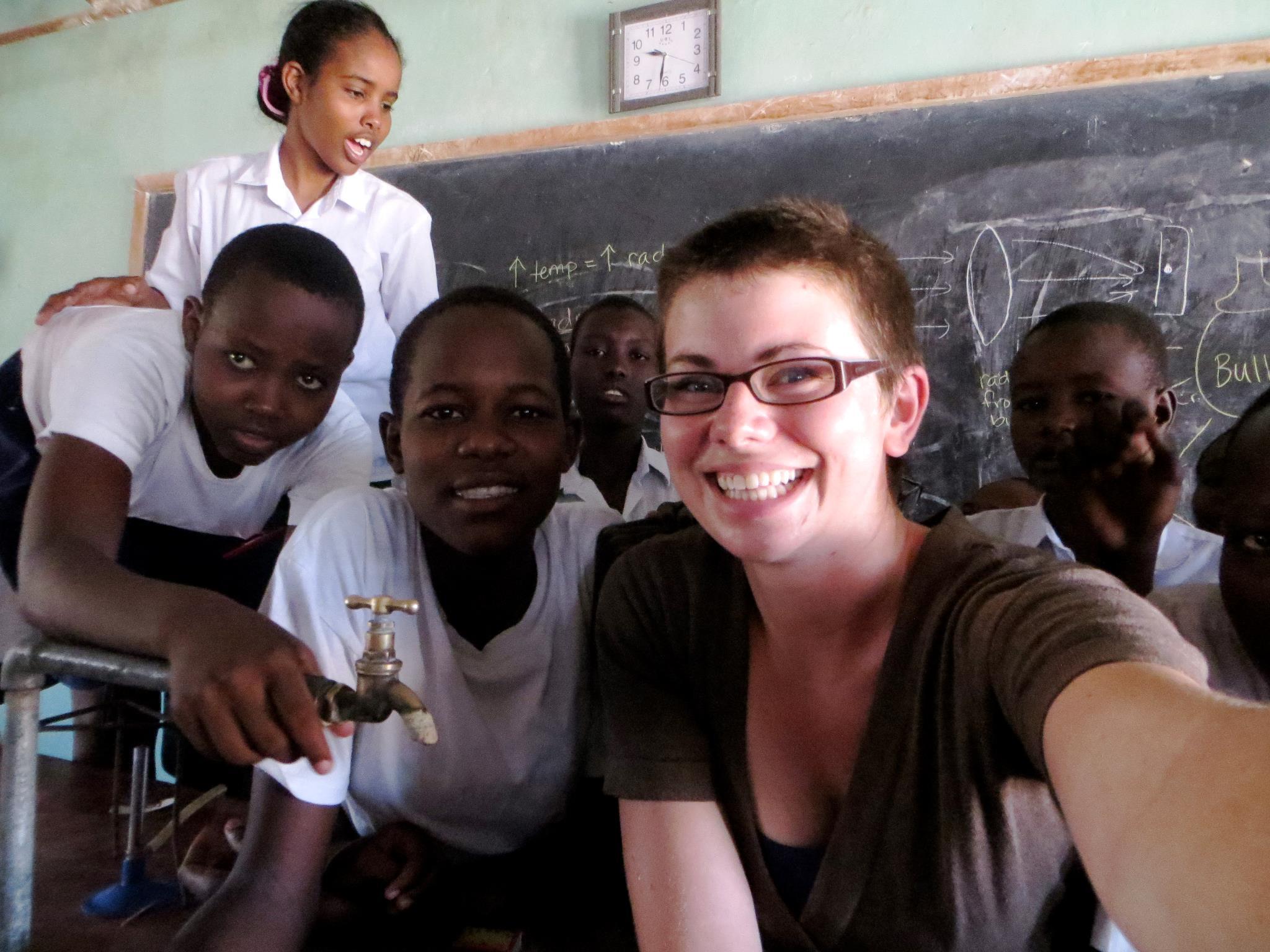 Eva Farrell takes selfie with kids in Kenya.