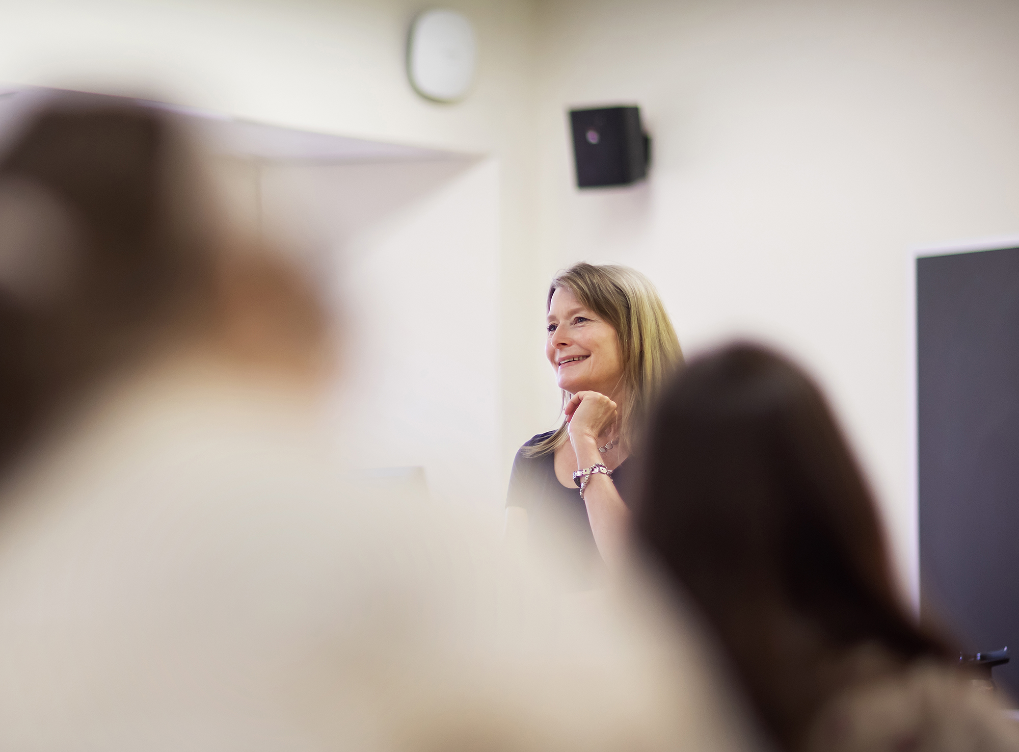 Jennifer Egan standing in front of class smiling