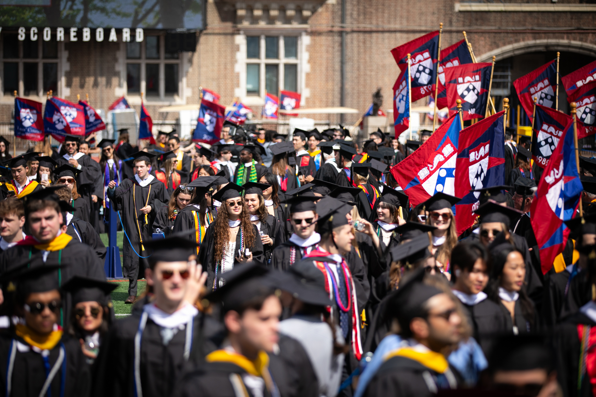 students processing into franklin field during commencement