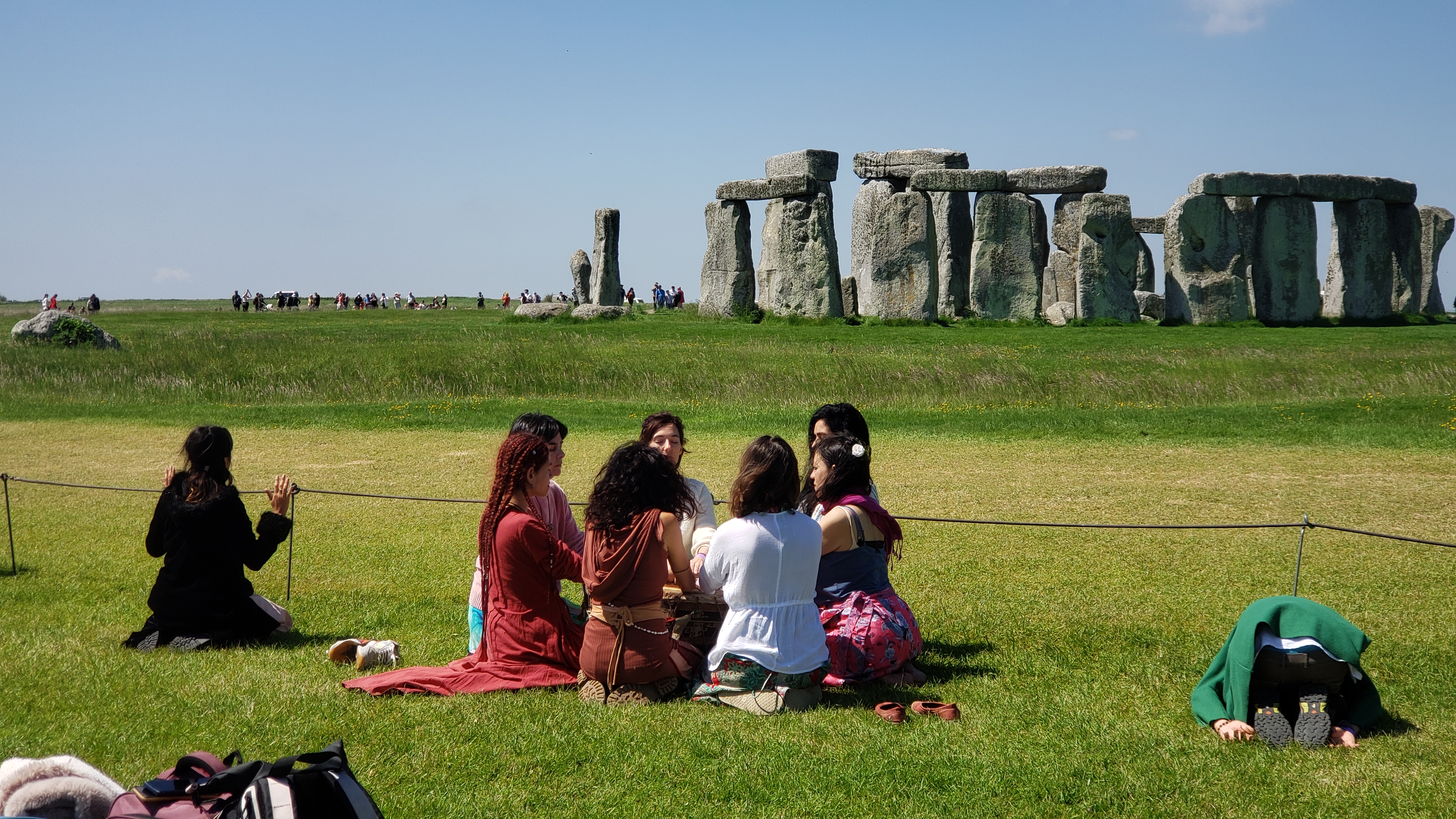 A group of Druids conducting a ceremony in front of Stonehenge. 