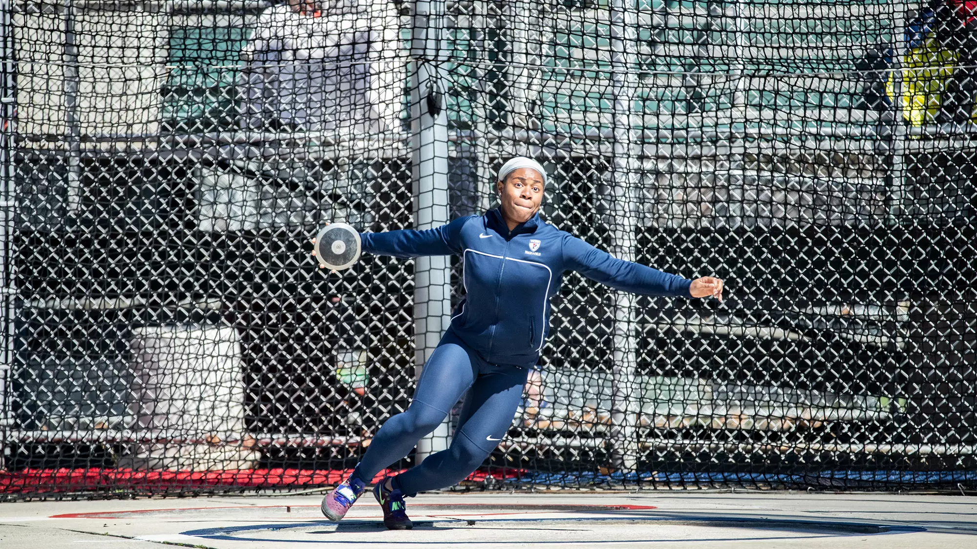 Ashley Anumba prepares to throw the discus during a Penn meet