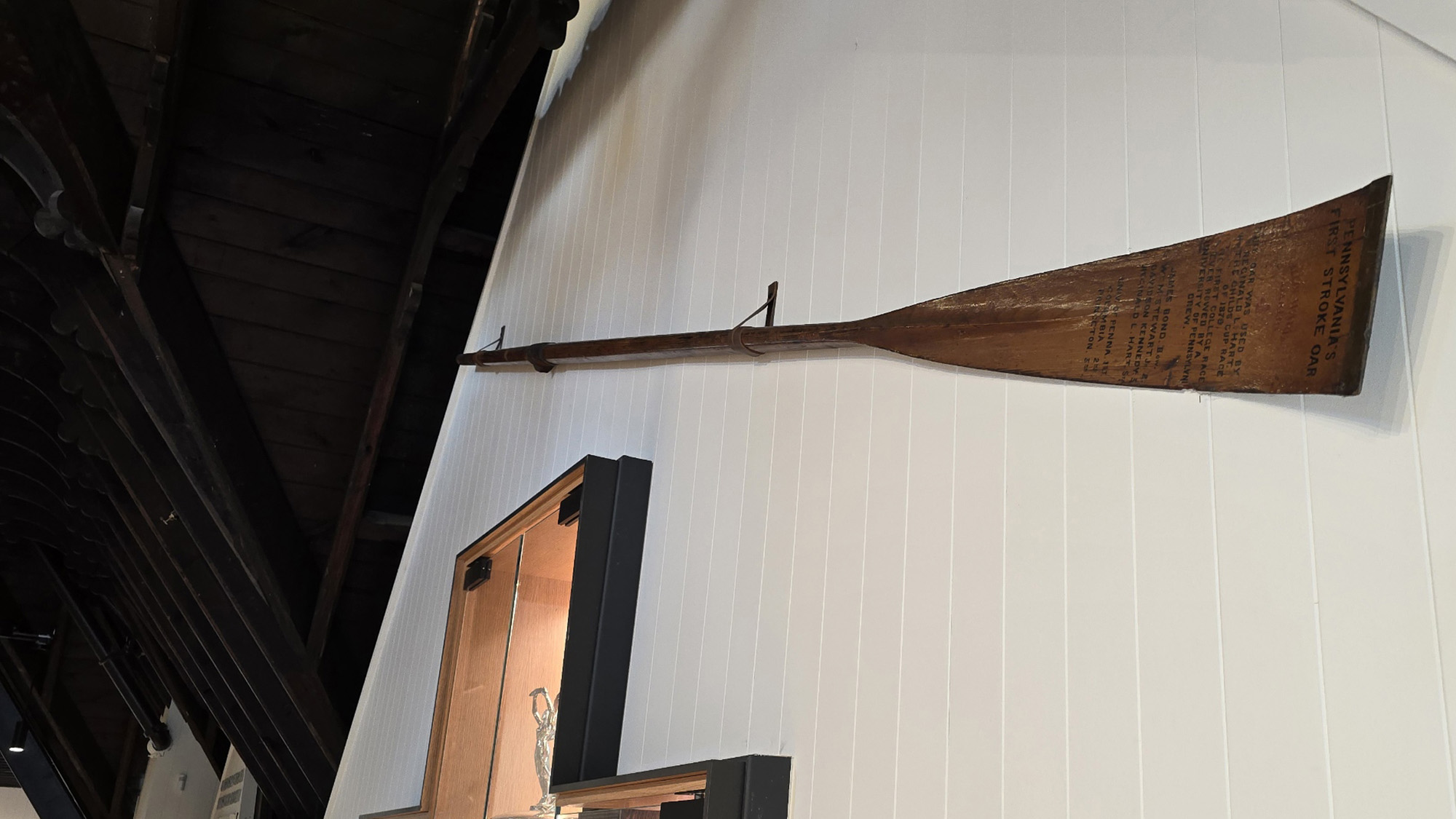 rowing oar mounted on the wall of Penn Boathouse