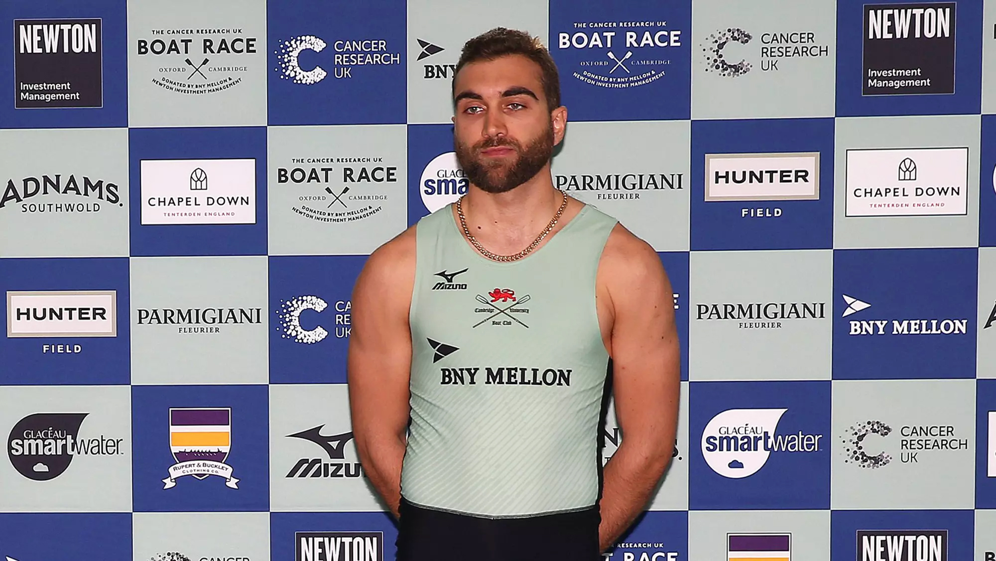 Dara Alizadeh stands with his hands behind his back while wearing his club uniform.