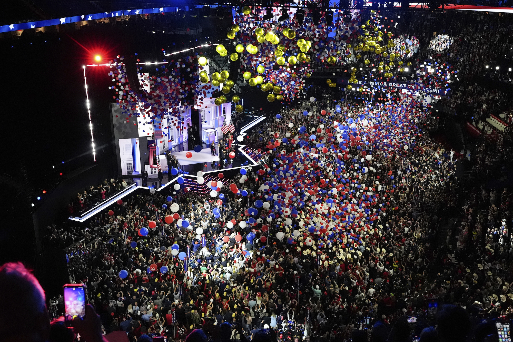 Red, white, blue and gold balloons are seen dropping into the crowd at the Republican National Convention in Milwaukee.