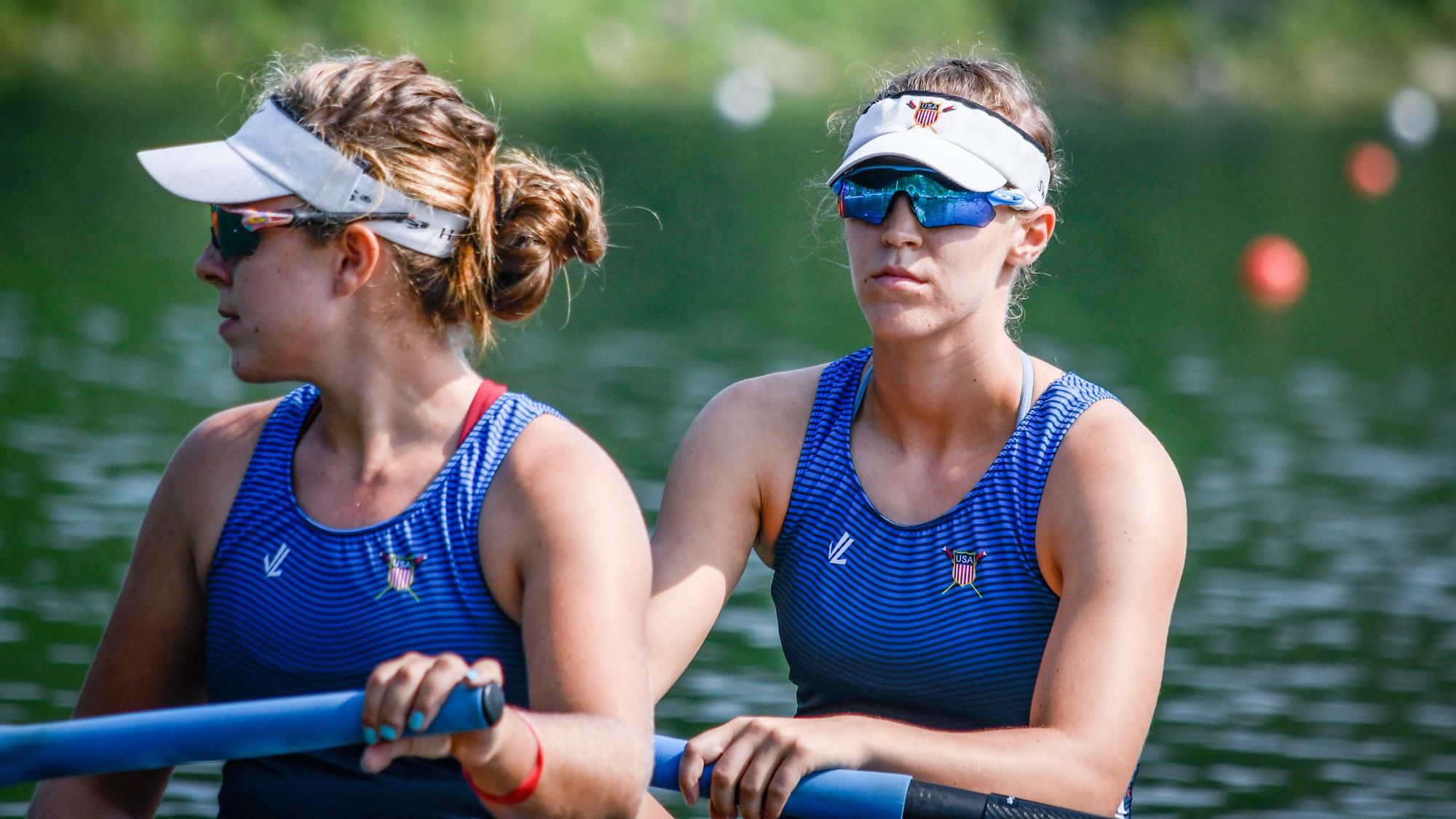 Regina Salmons, right, rows in a race during a competition 