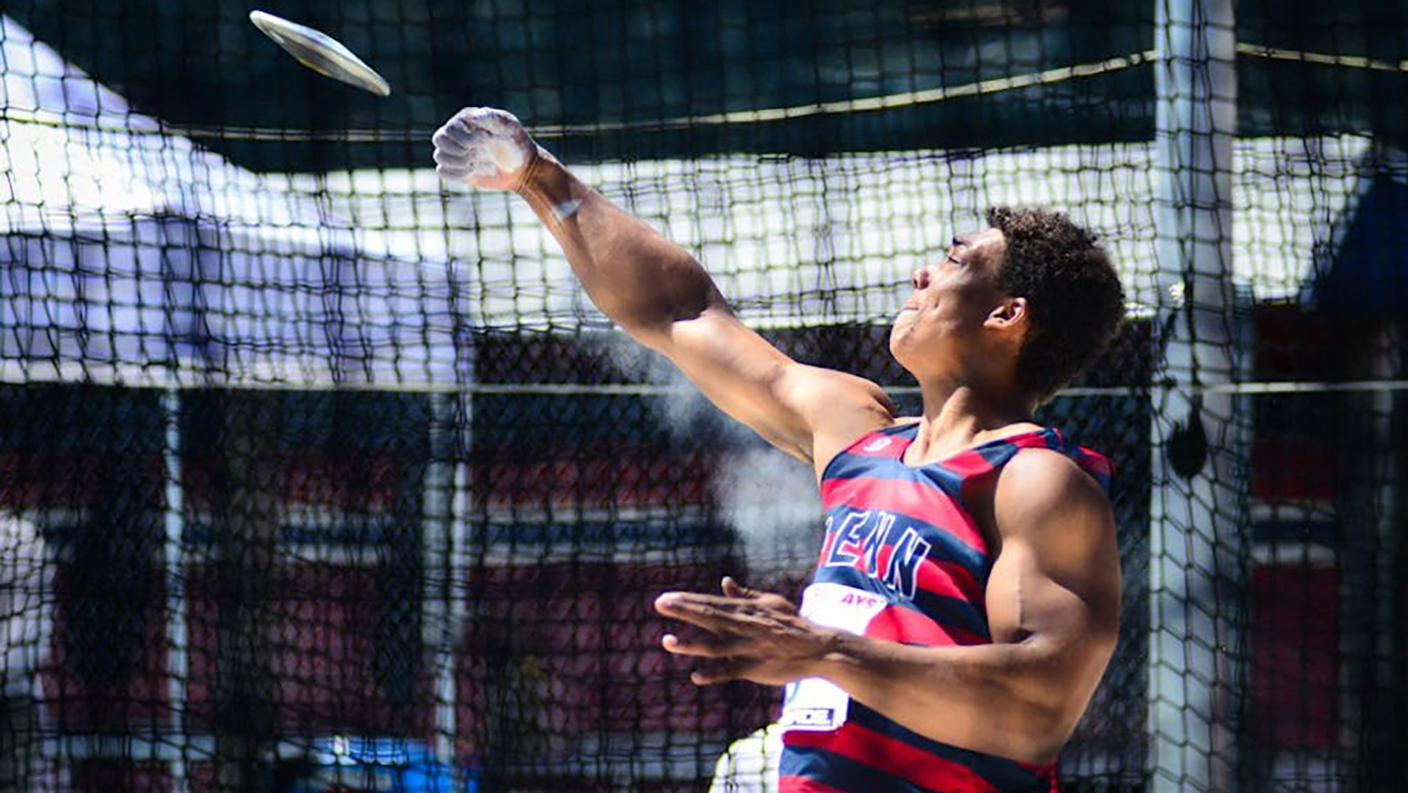 Sam Mattis throws the discus during a Penn meet.