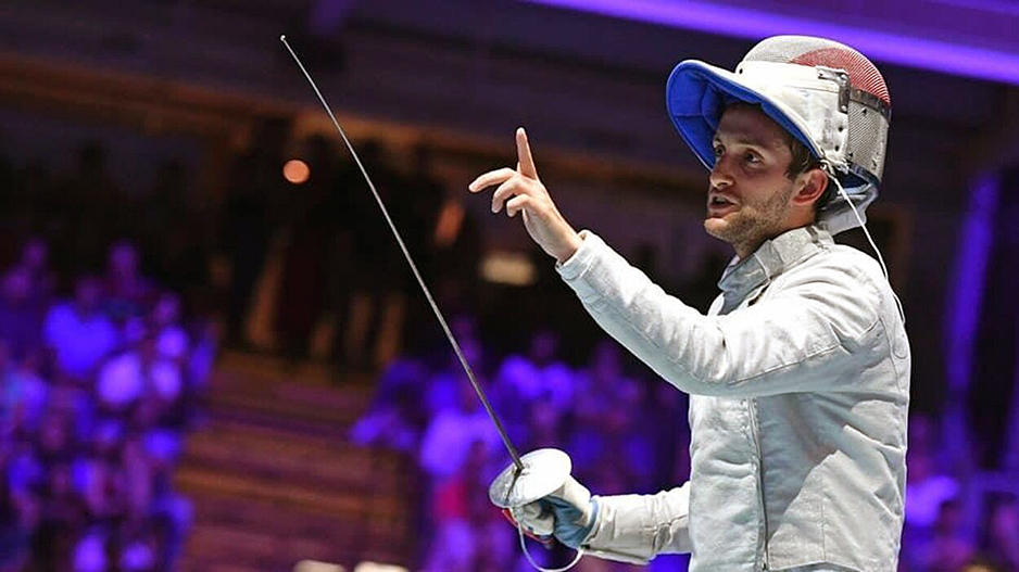 Shaul Gordon holds his fencing sword during a competition