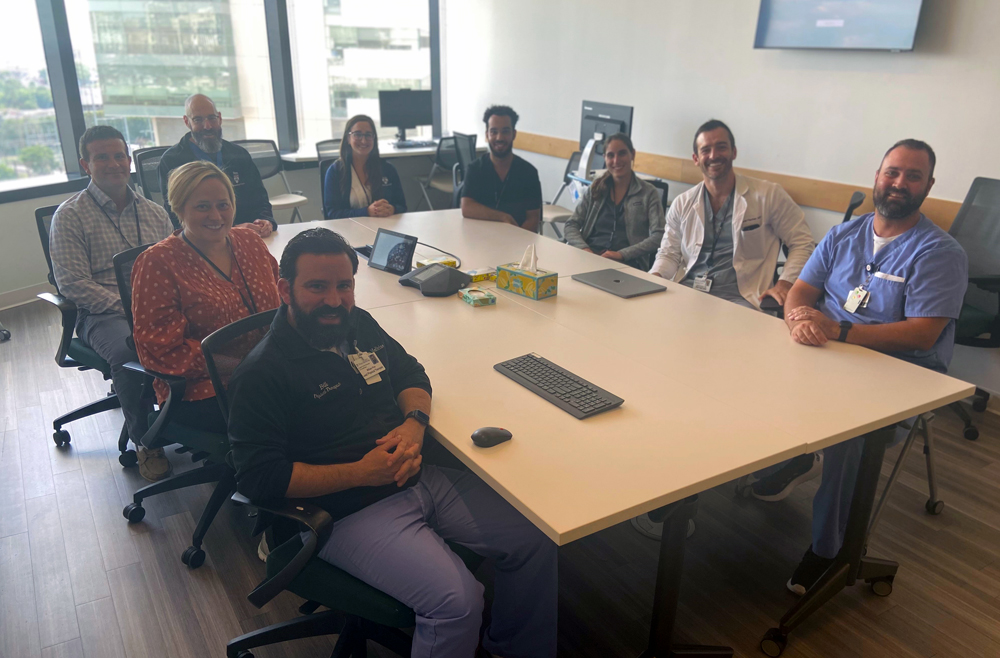 Penn Medicine’s coma team seated at a table.