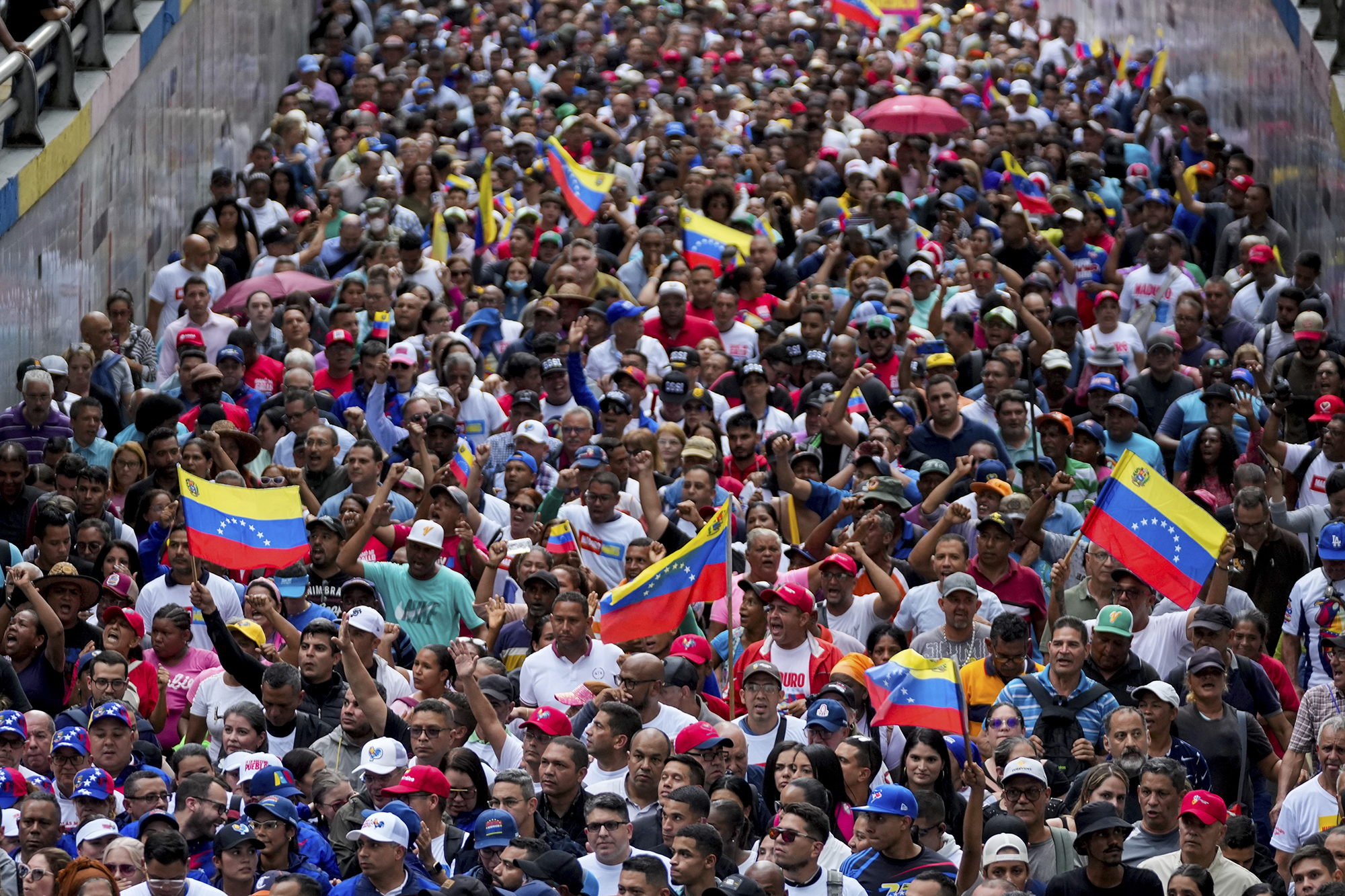 A crowd of people protesting the election in Venezuela.