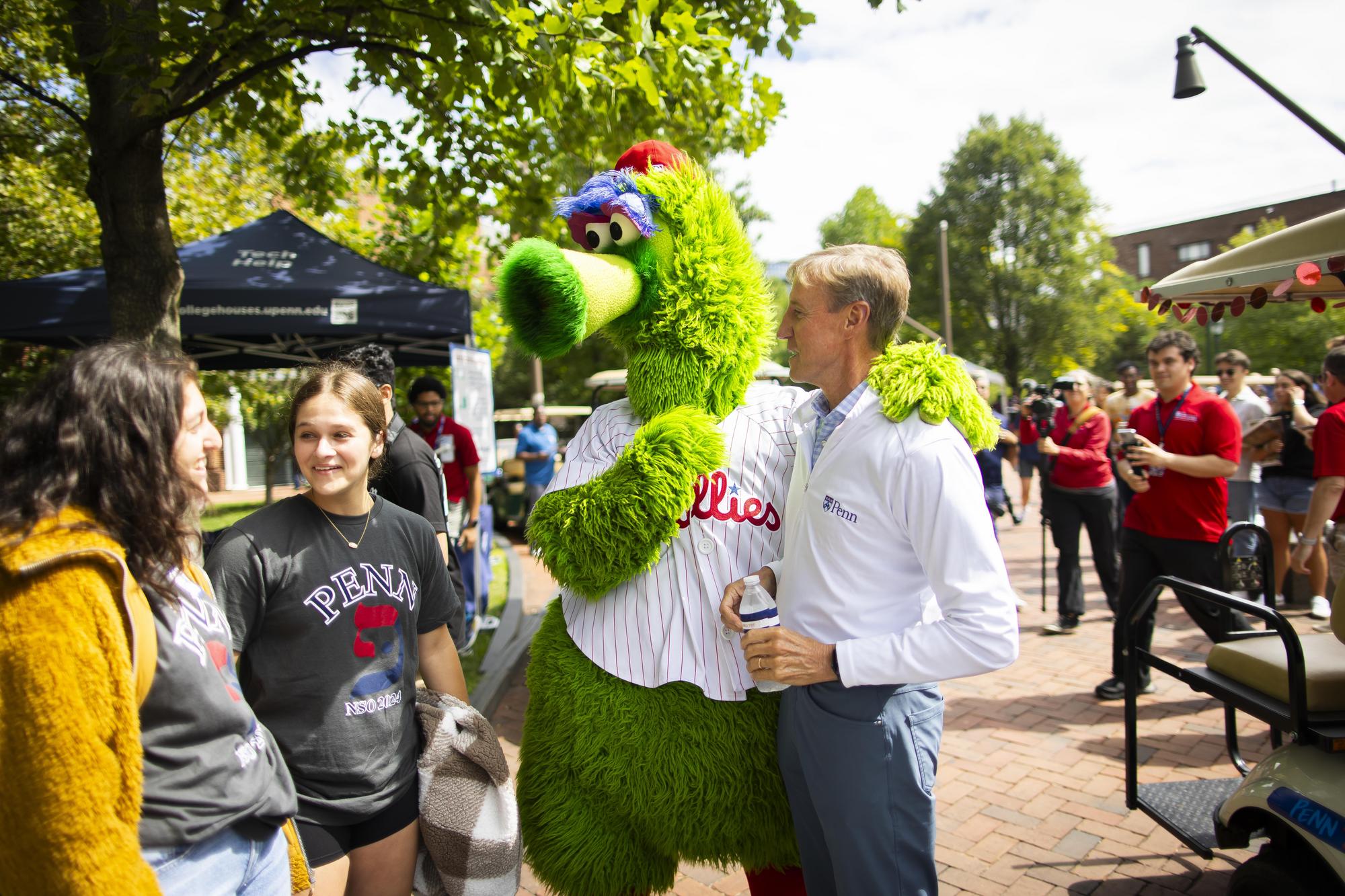 The Philly Phanatic, Penn President J. Larry Jameson talk with students and parents on Penn’s campus during Move-In day.