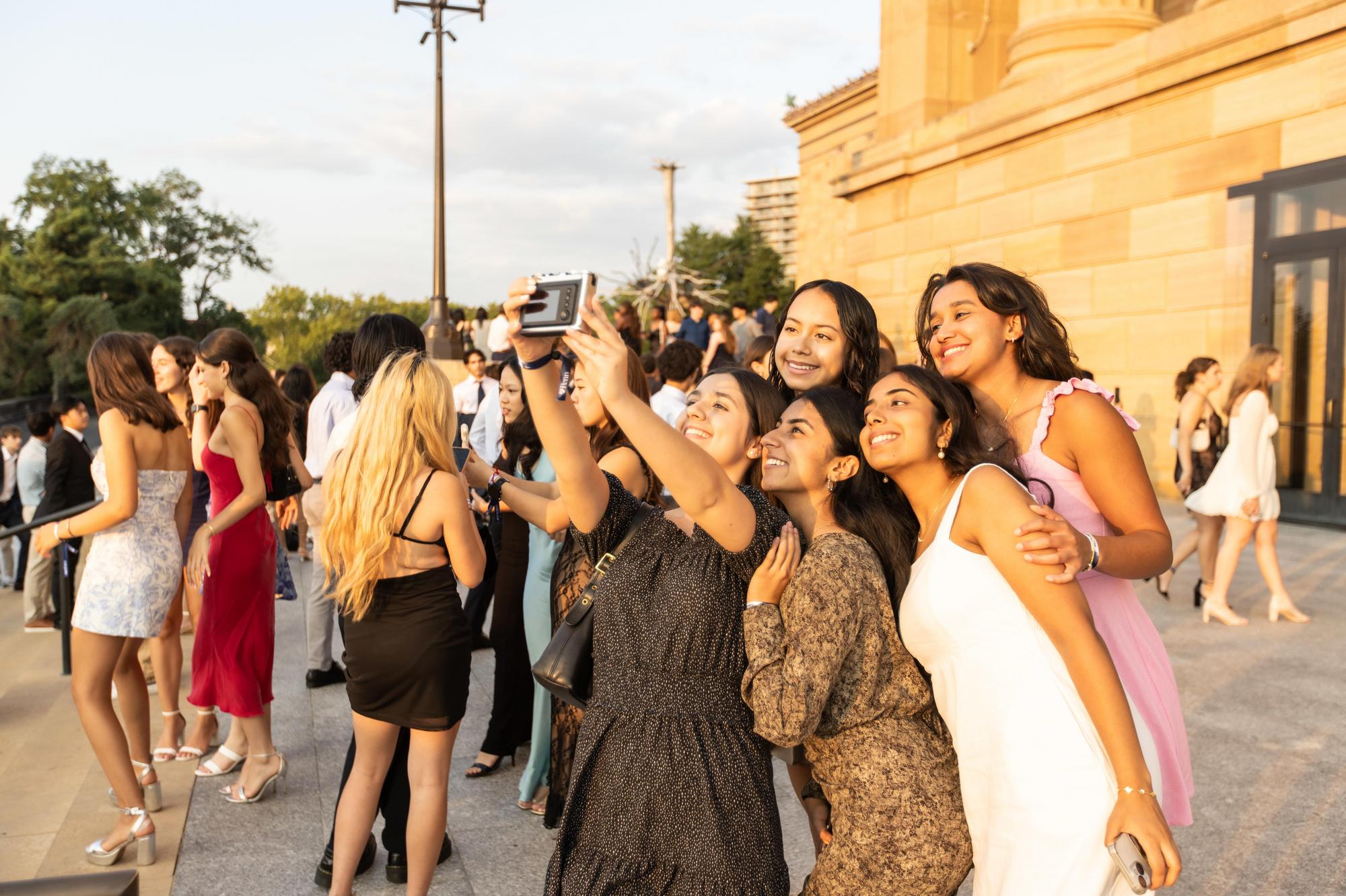 A group of new Penn students take a selfie in front of the Philly Art Museum on NSO weekend.