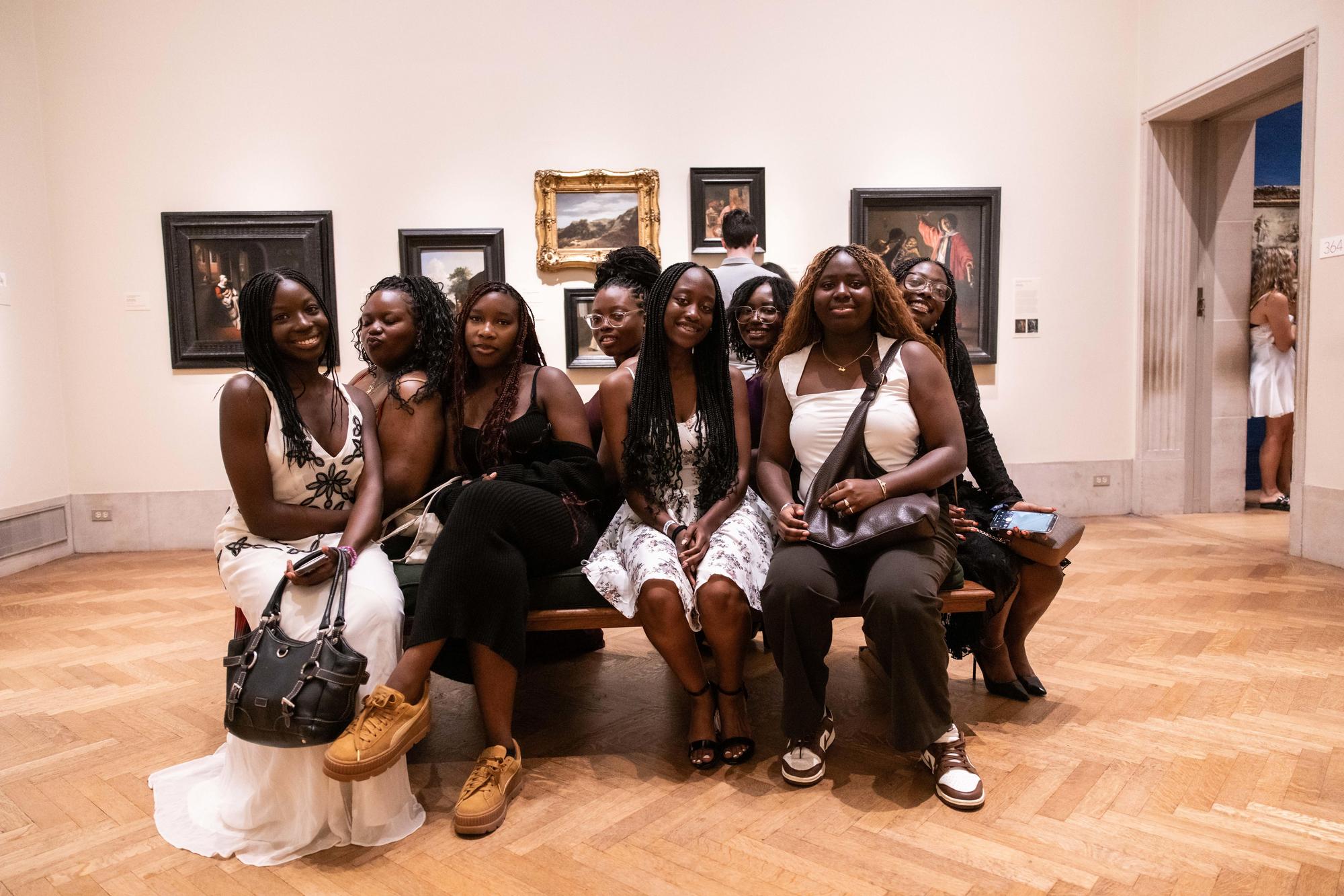 A group of new Penn students on a bench in the Philly Art Museum on NSO weekend.