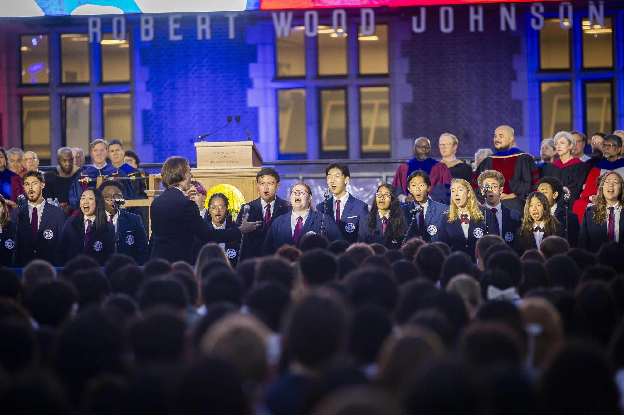 Singers on stage at Franklin Field during Convocation for Penn’s class of 2028.