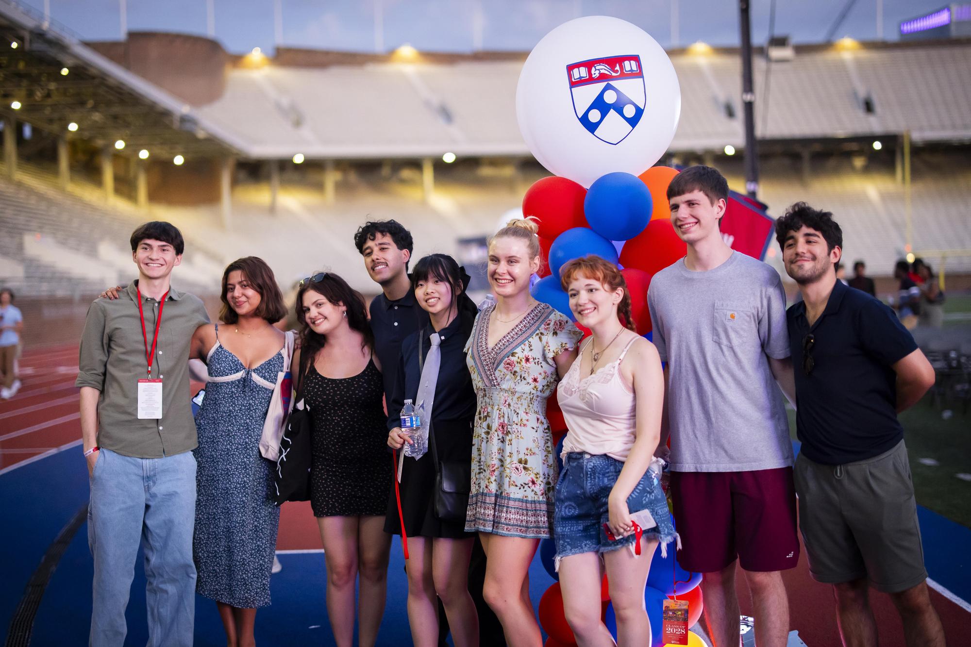 A group of new Penn students on Franklin Field during Convocation for the Class of 2028.