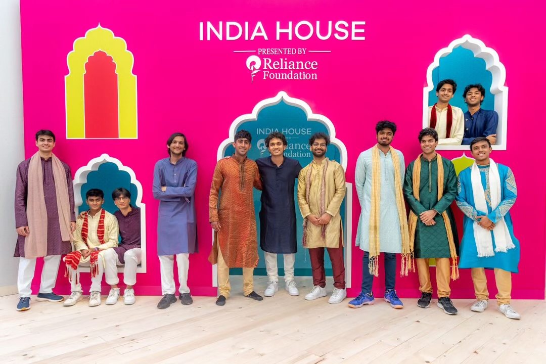 Penn Masala members standing in front of sign India House