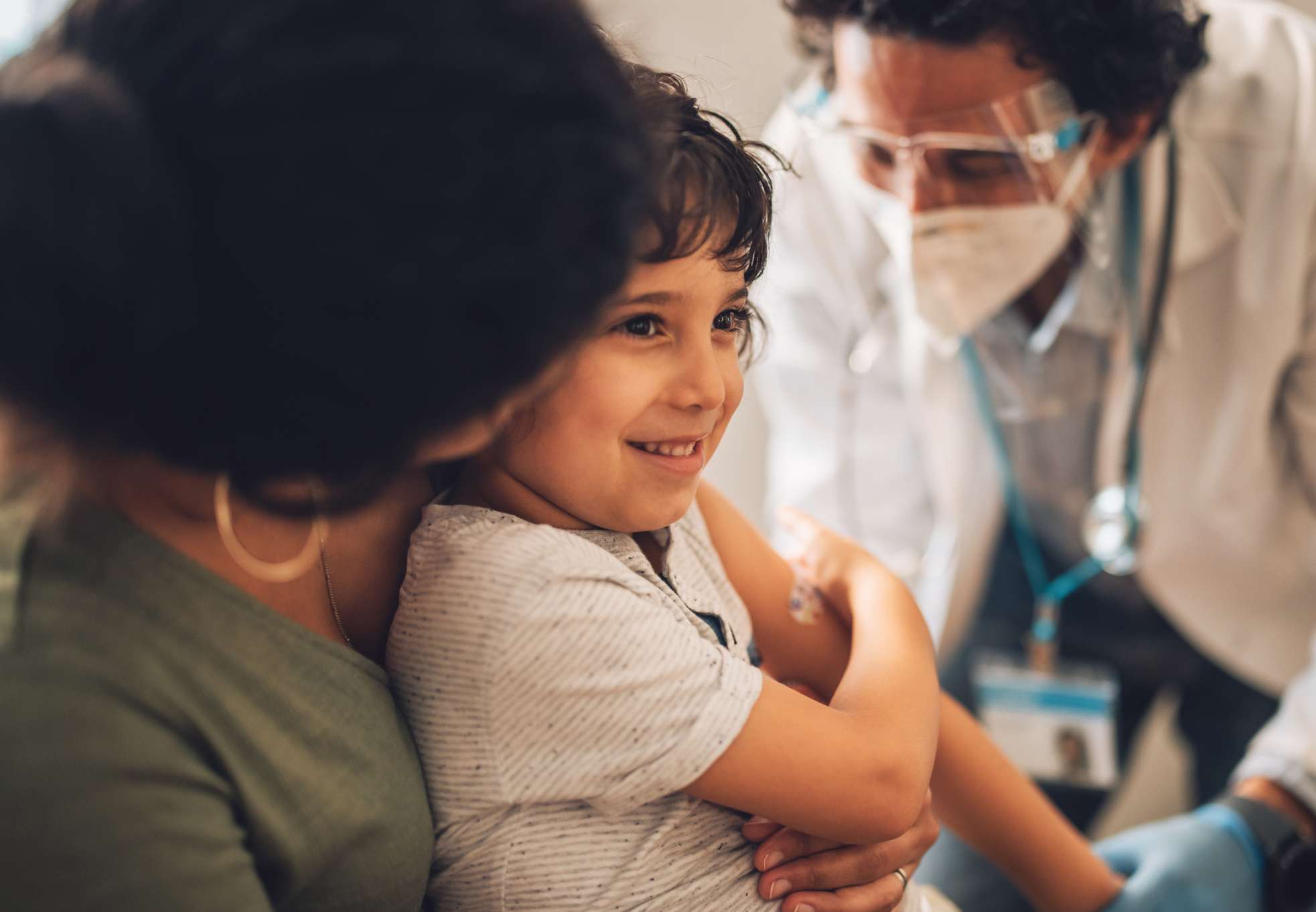 A young child getting a vaccine.