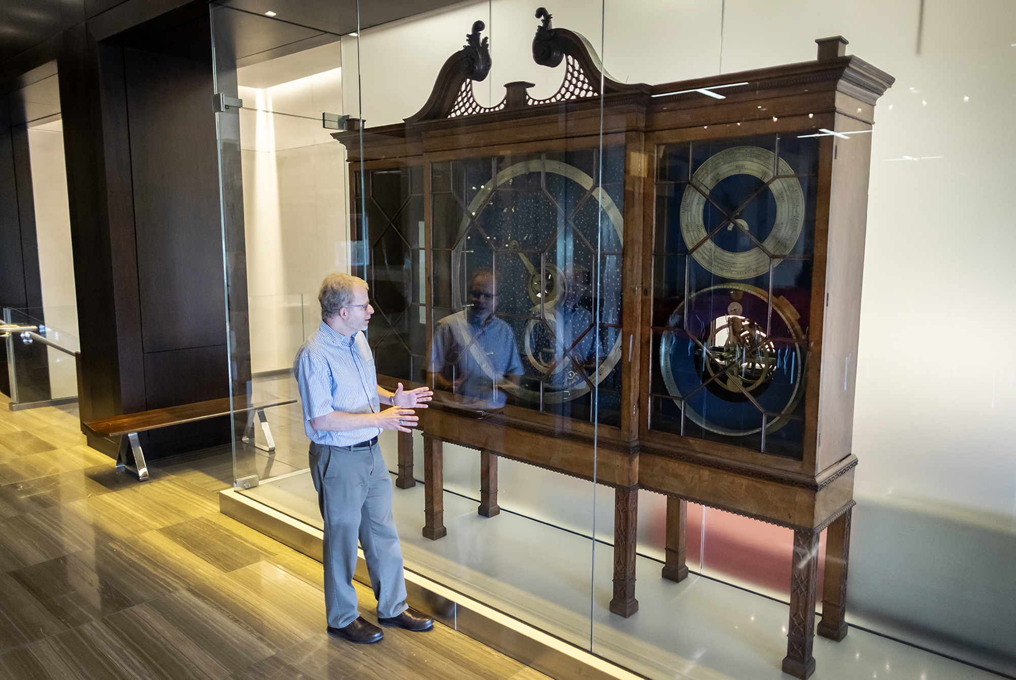 John Pollack standing in front of the Rittenhouse Orrery