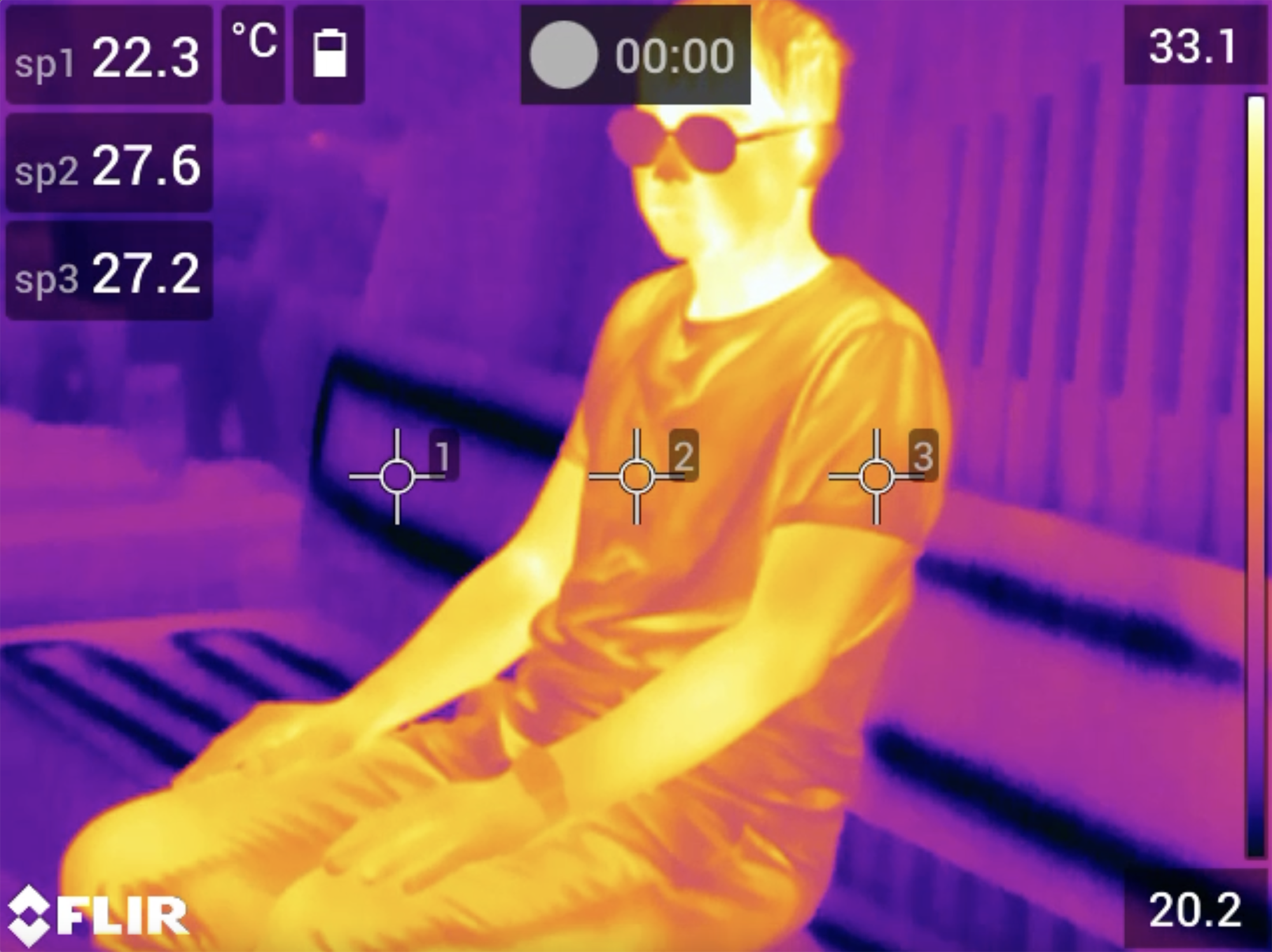 A thermal scan of a person sitting in a cooling shelter.