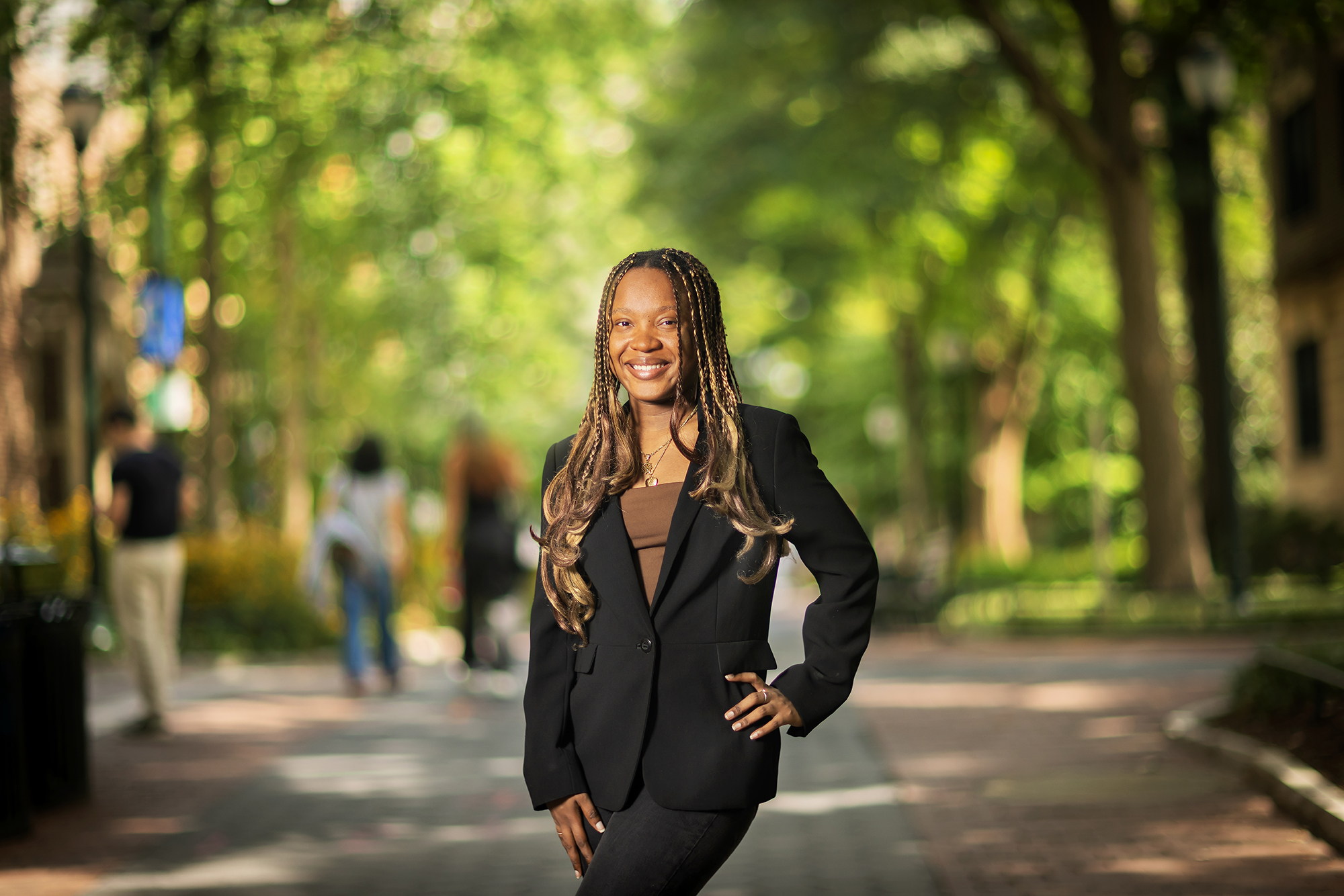 Gabriella Jean wears a pants suit while standing on College Walk.