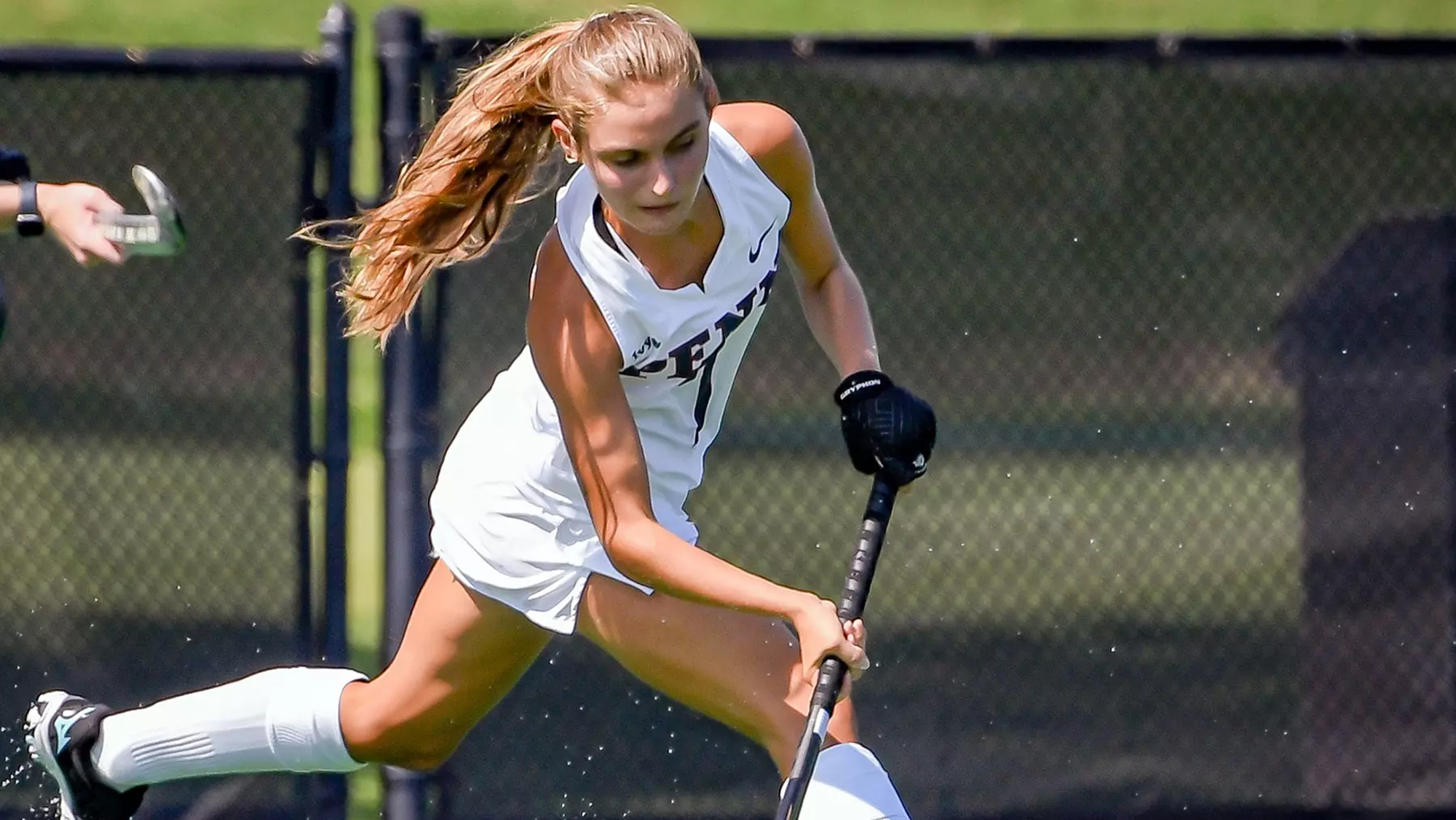 Sydney Mandato hits the ball with her stick during a game.