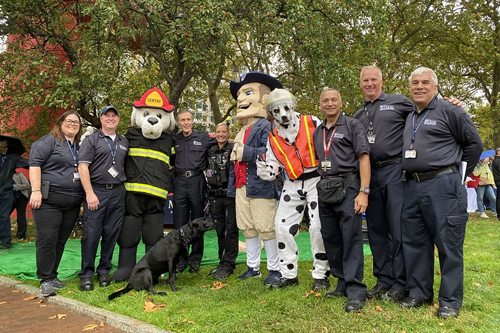 Officials from PFD, Penn Vet, alongside the Penn Quaker mascot and Fire Chief Gene Janda.