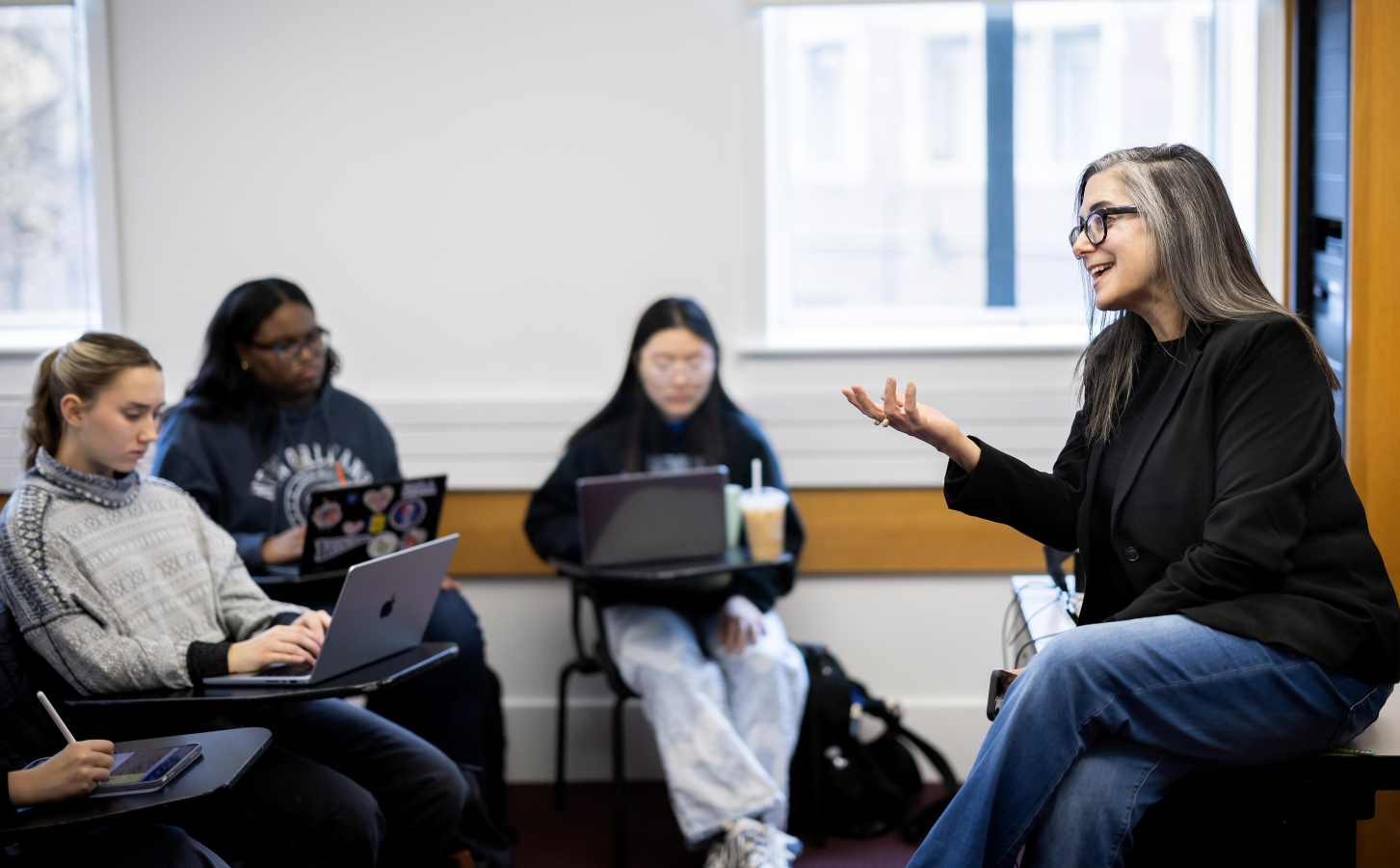 A Penn professor leading a seminar to a class of first-year students.