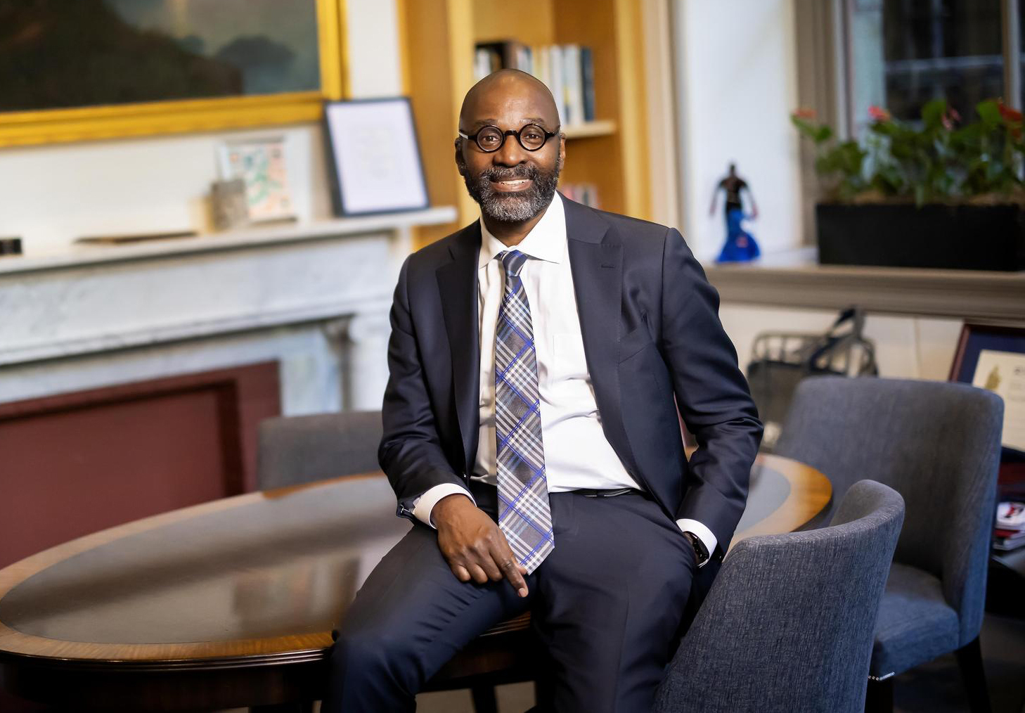 John Jackson inside an office with a table and chairs.