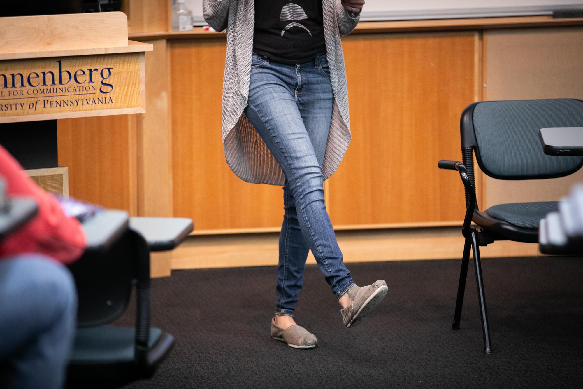 An image of Jessa Lingel in skinny jeans, standing on one leg. A podium to the left reads "Annenberg School for Communication University of Pennsylvania"