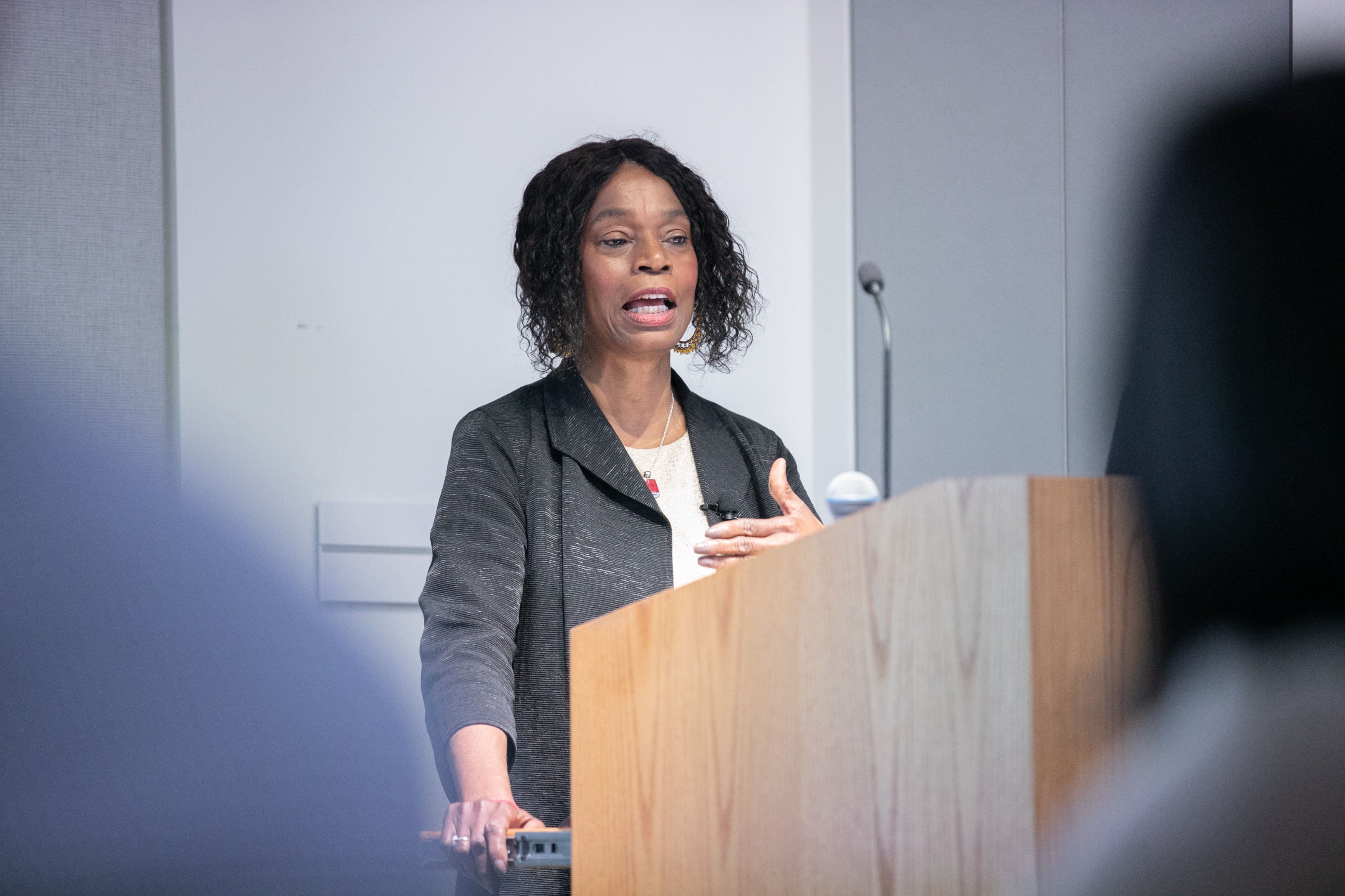 Anita Allen speaking at a podium.