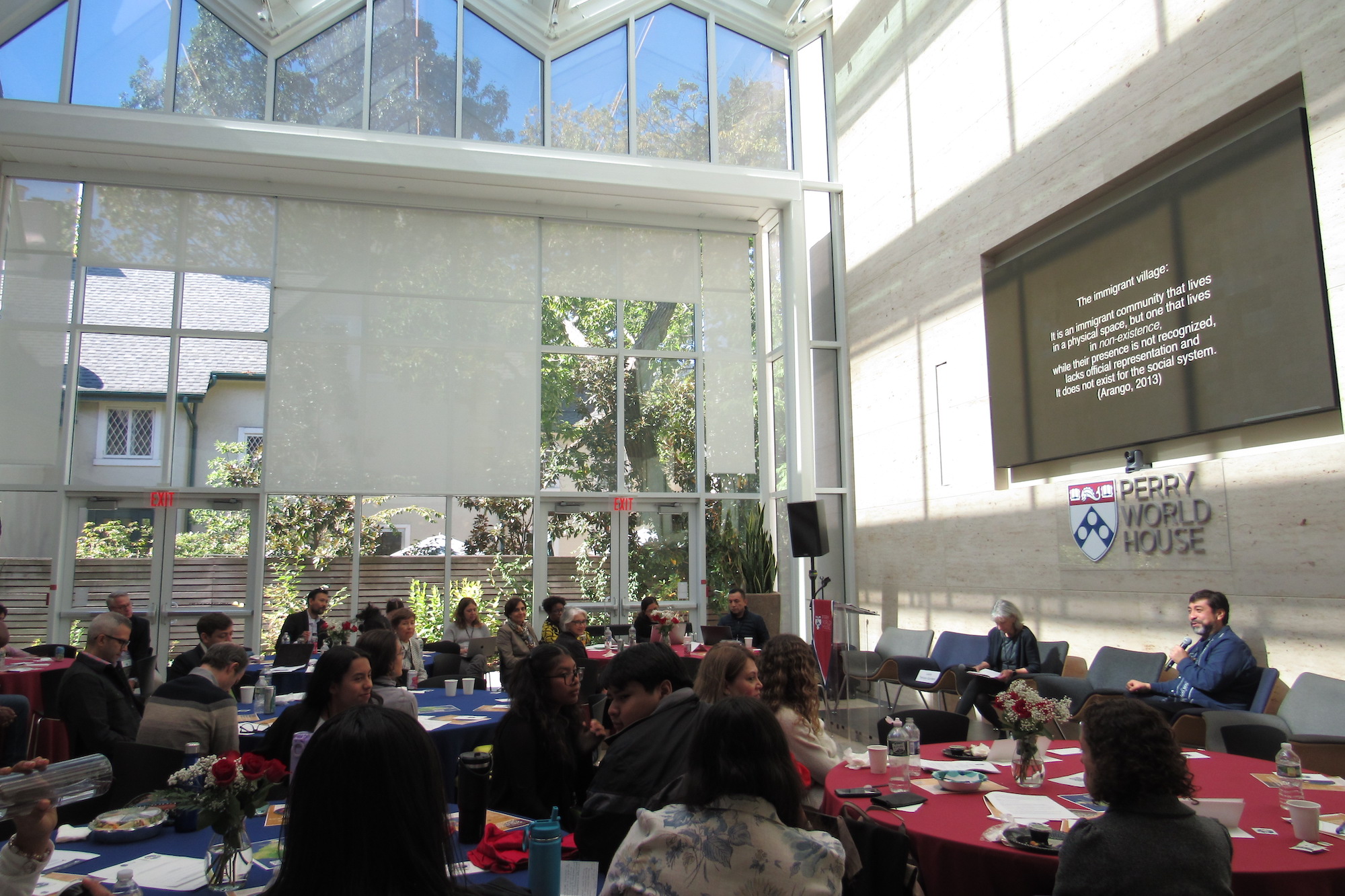 The interior main room of Perry World House, where conference attendees listen to a presentation