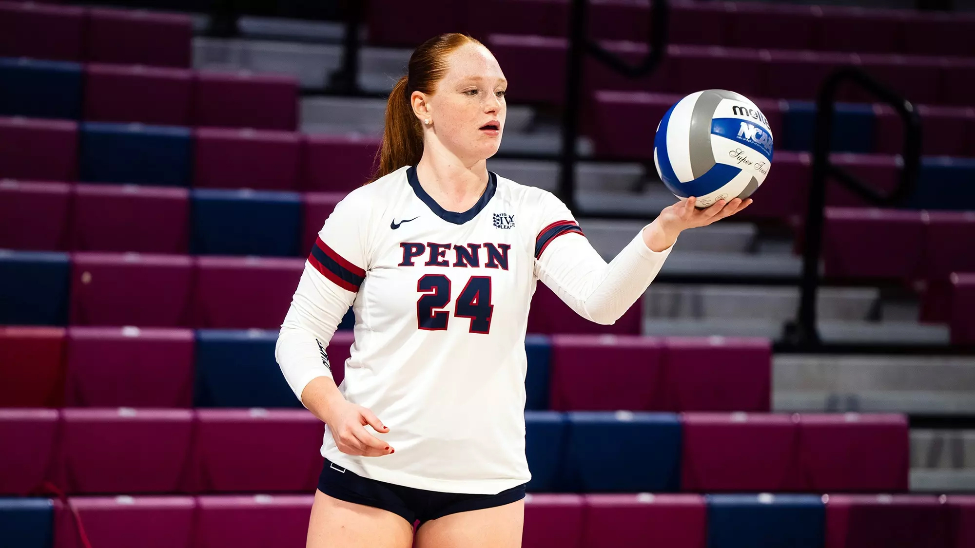 Emery Moore prepares to hit the ball during a game at the Palestra.