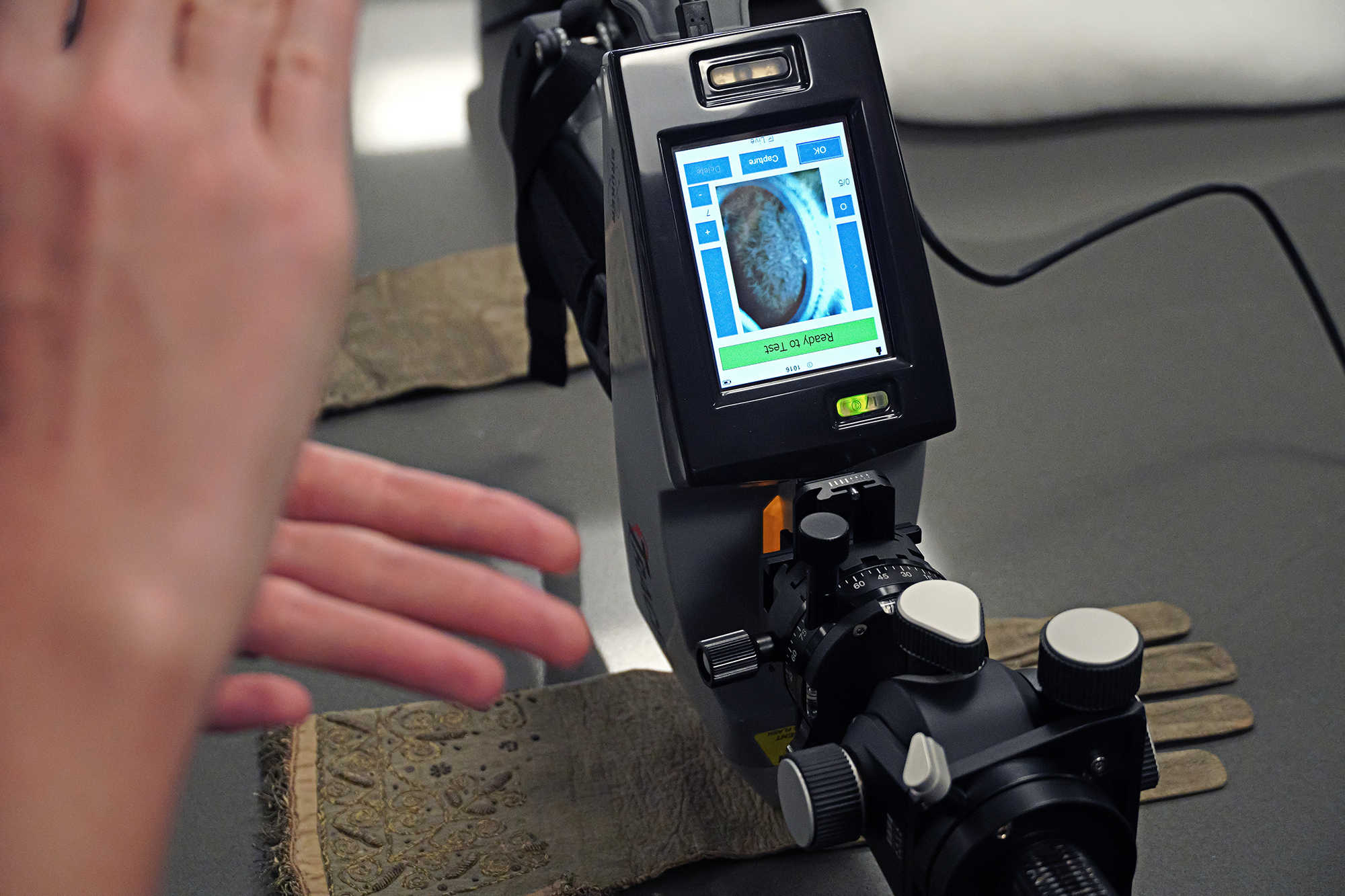 Historic gloves being scanned for carbon dating.