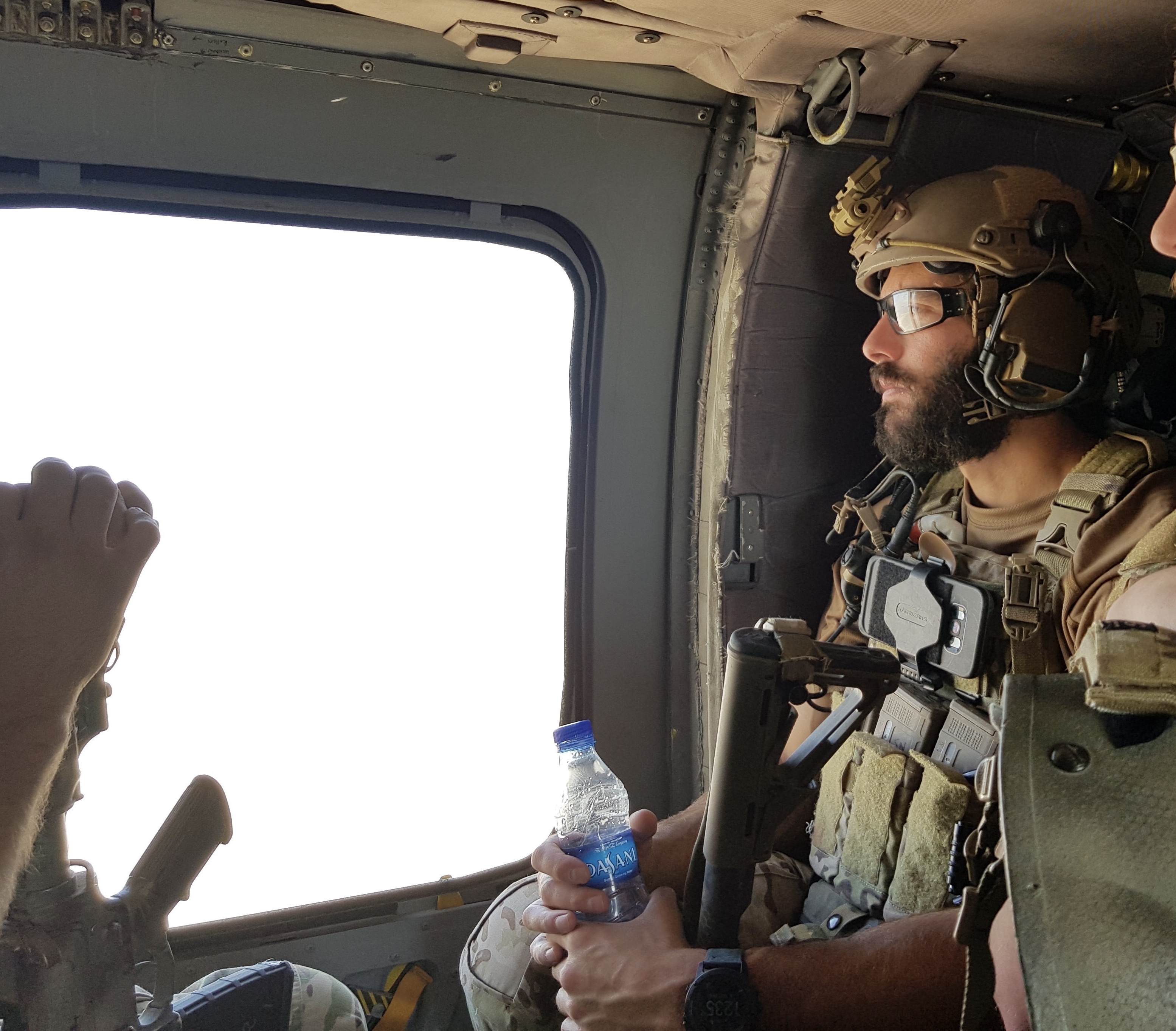 Dan Swensen sits by the window of an aircraft 