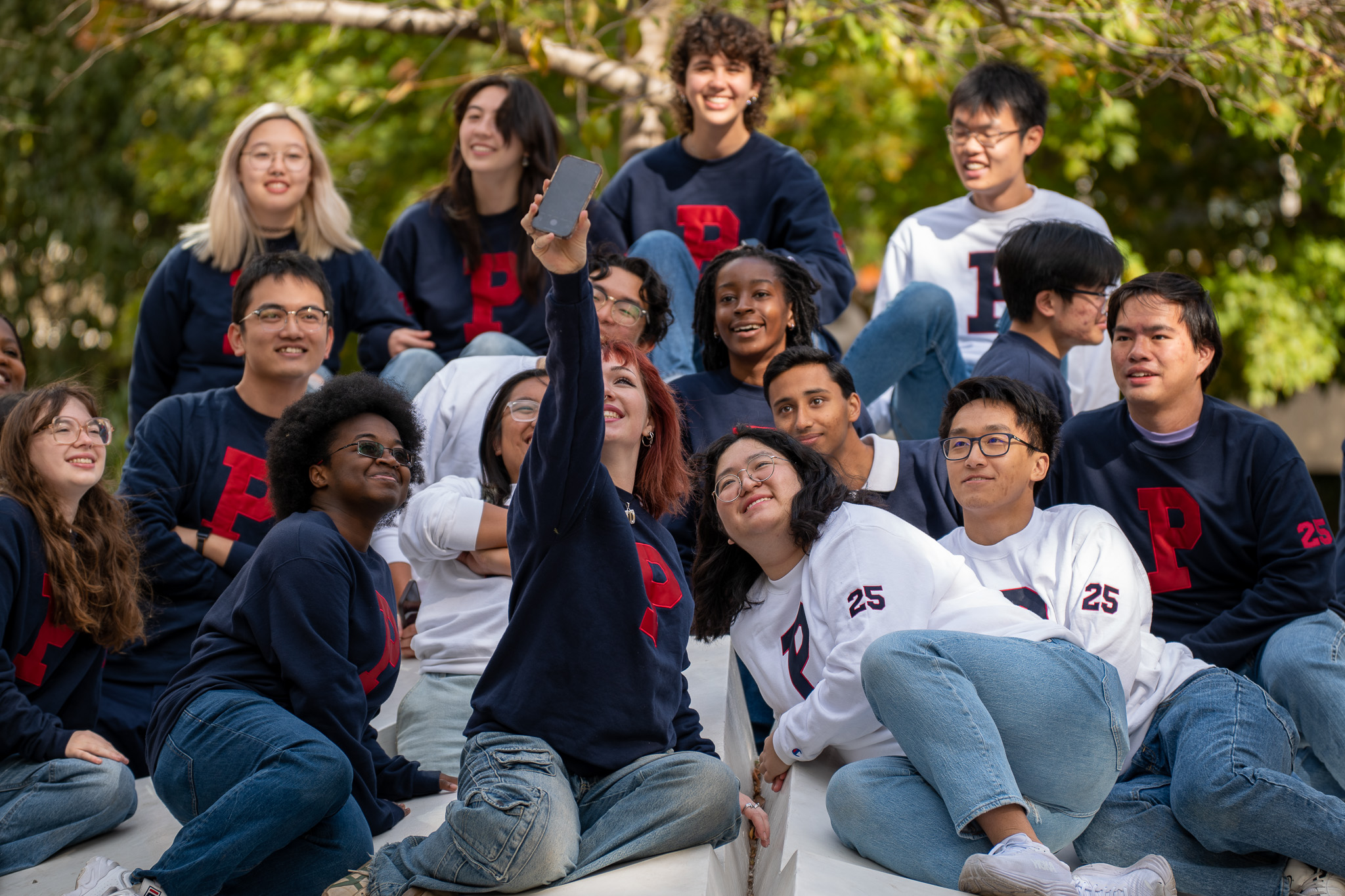 A group of Penn students pose for a selfie.