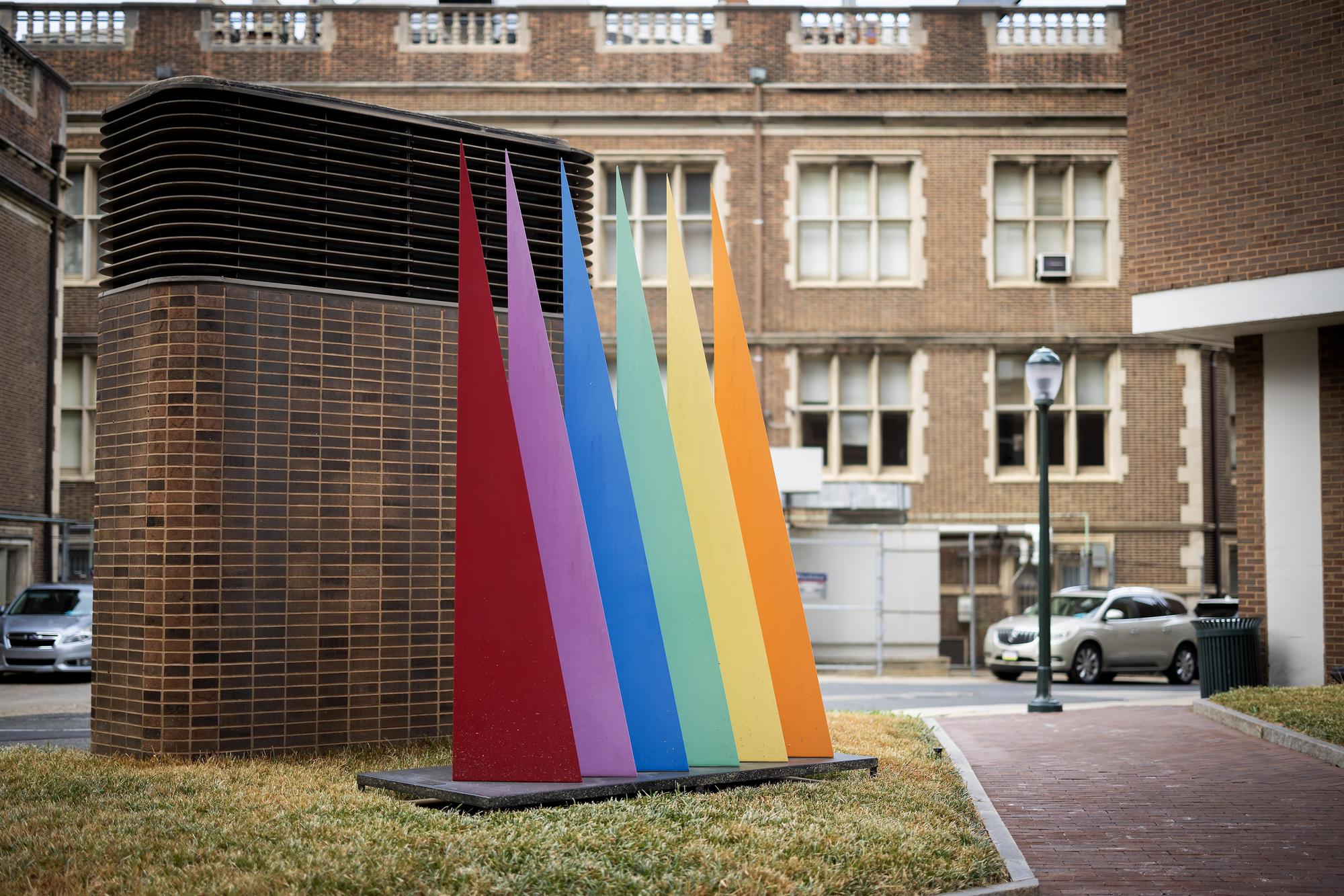 The "Six Triangles" sculpture has six colored steel triangles pointing toward the sky.