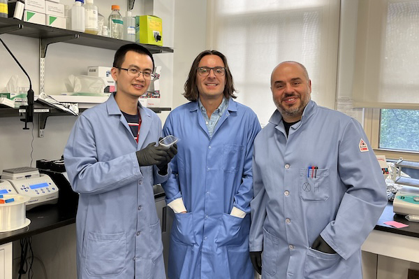 Xuexiang Han, Michael Mitchell and Mohamed-Gabriel Alameh in a lab.