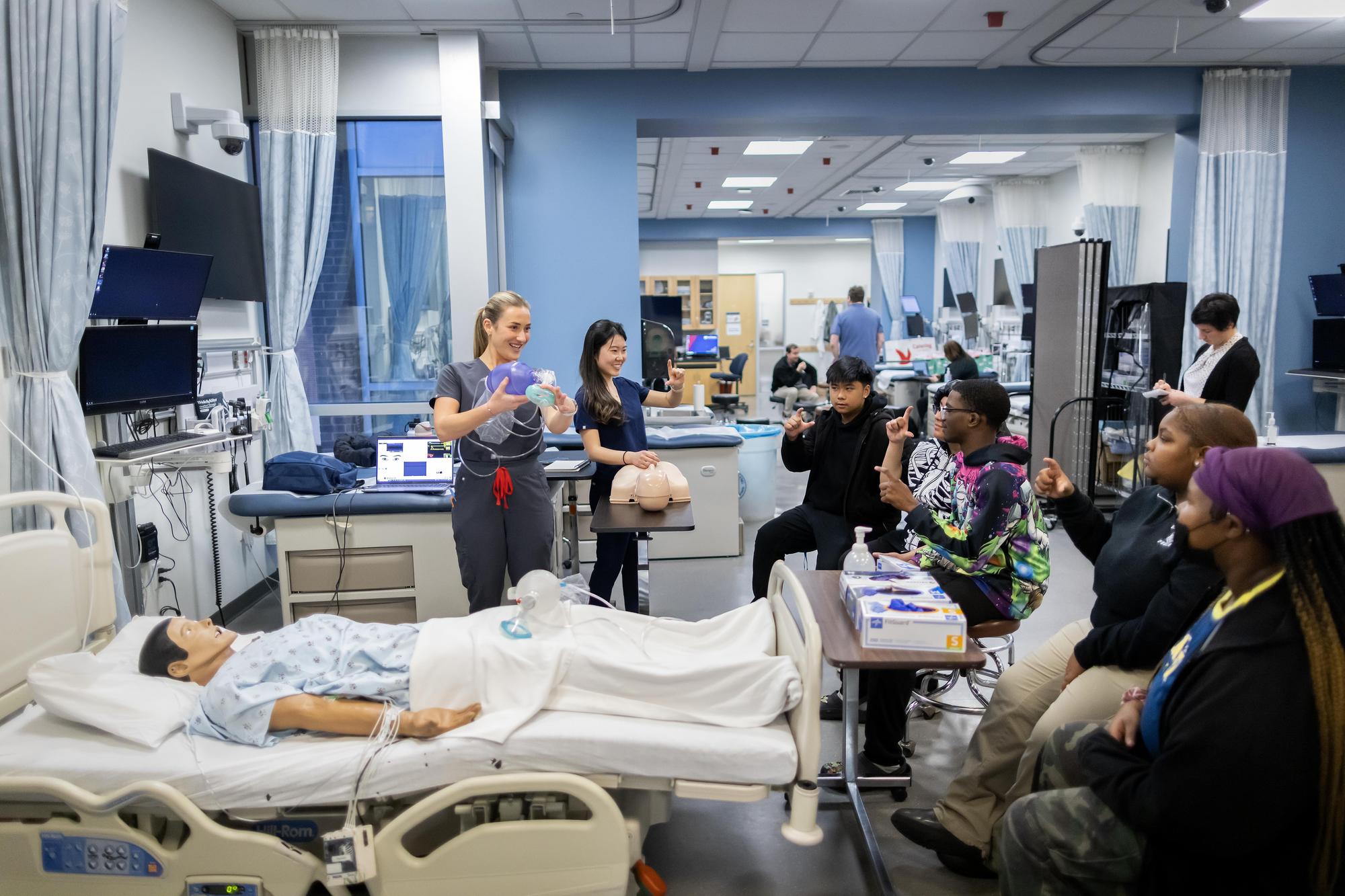 Penn Nursing students teach high school students about CPR.