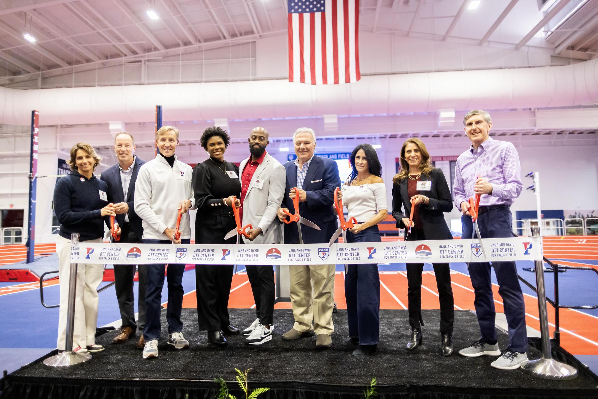 People cutting a symbolic ribbon at the Ott Center Ribbon Cutting event.