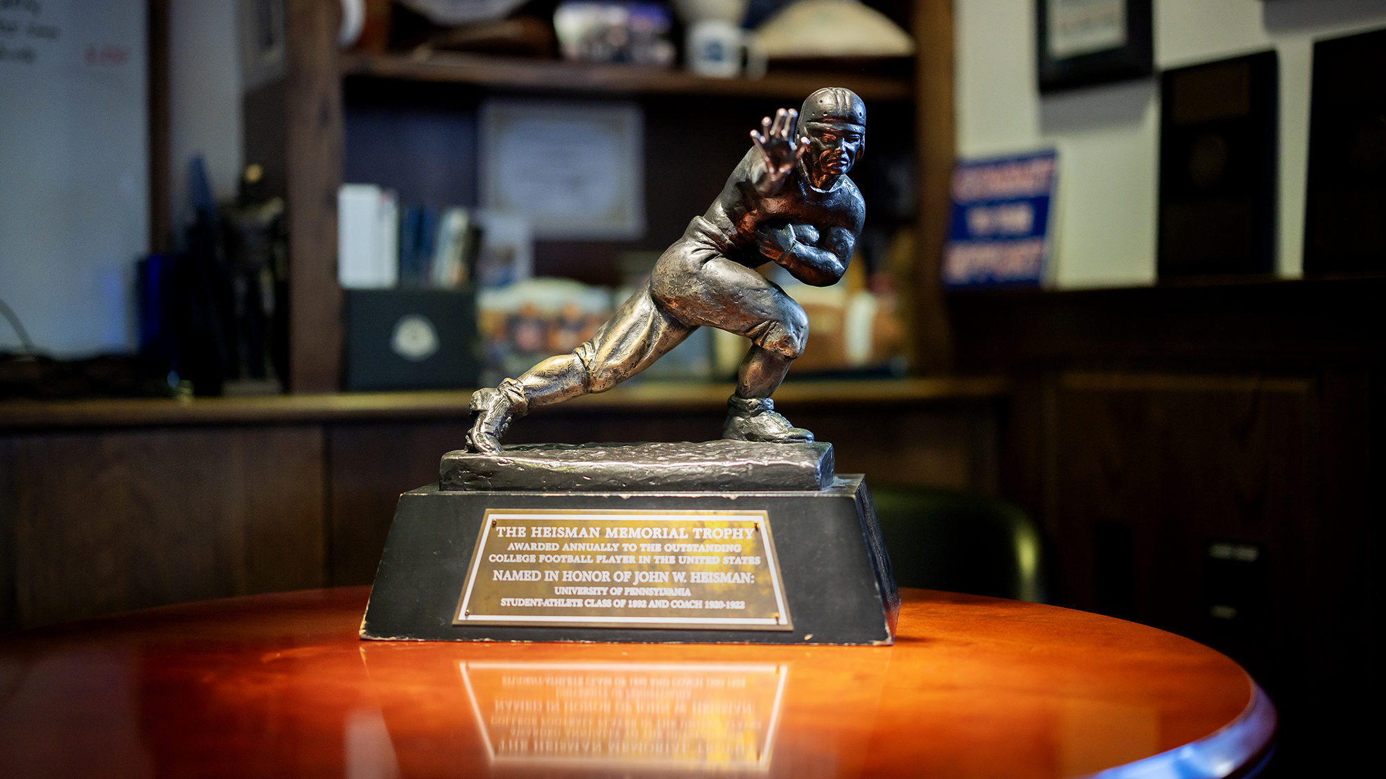 The Heisman Trophy in the office of football coach Ray Priore.