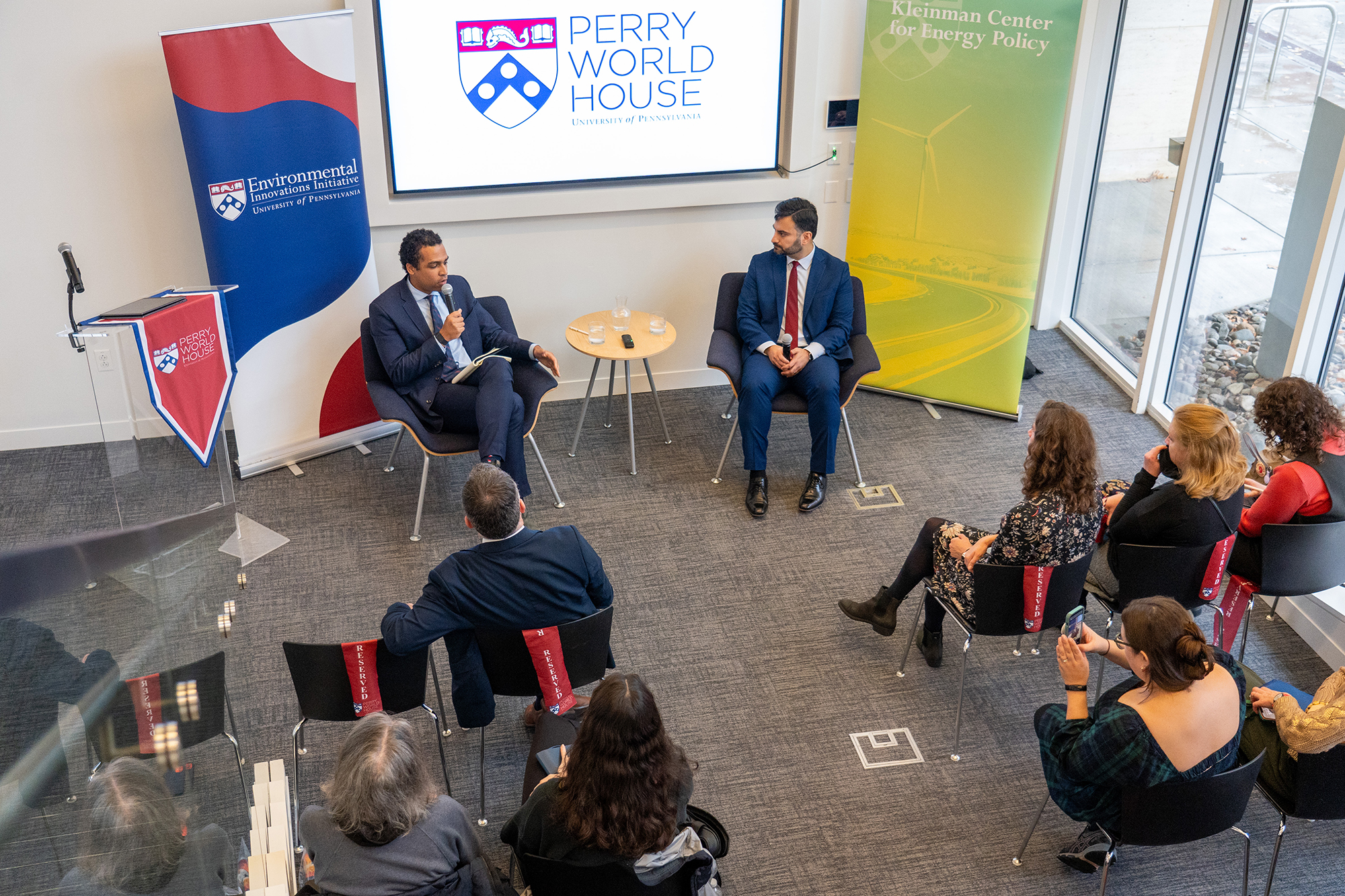 Ali Zaidi (right) and Justin Worland in discussion at Perry World House.