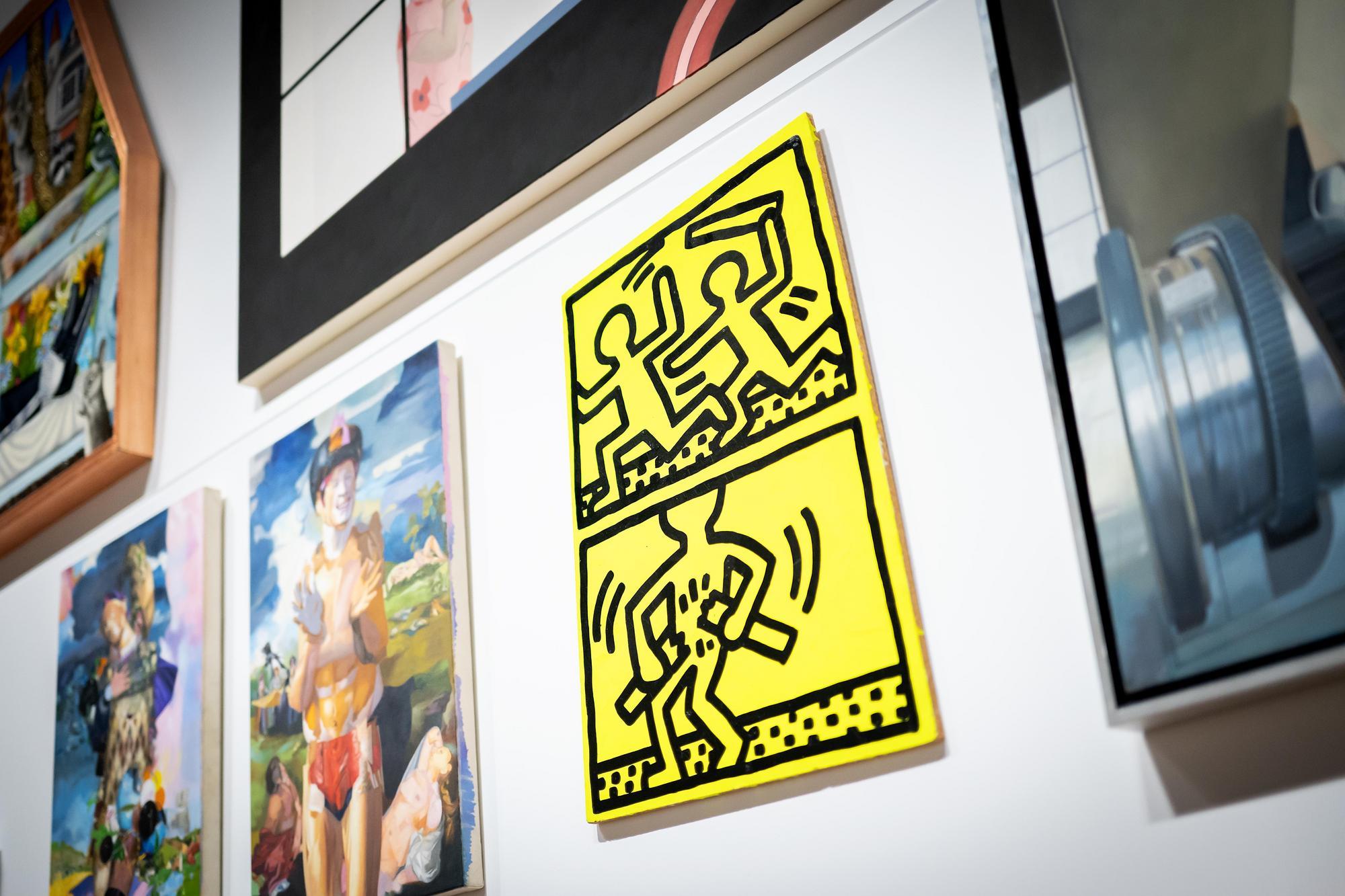 A Keith Haring painting and other artworks in the After Modernism exhibit.