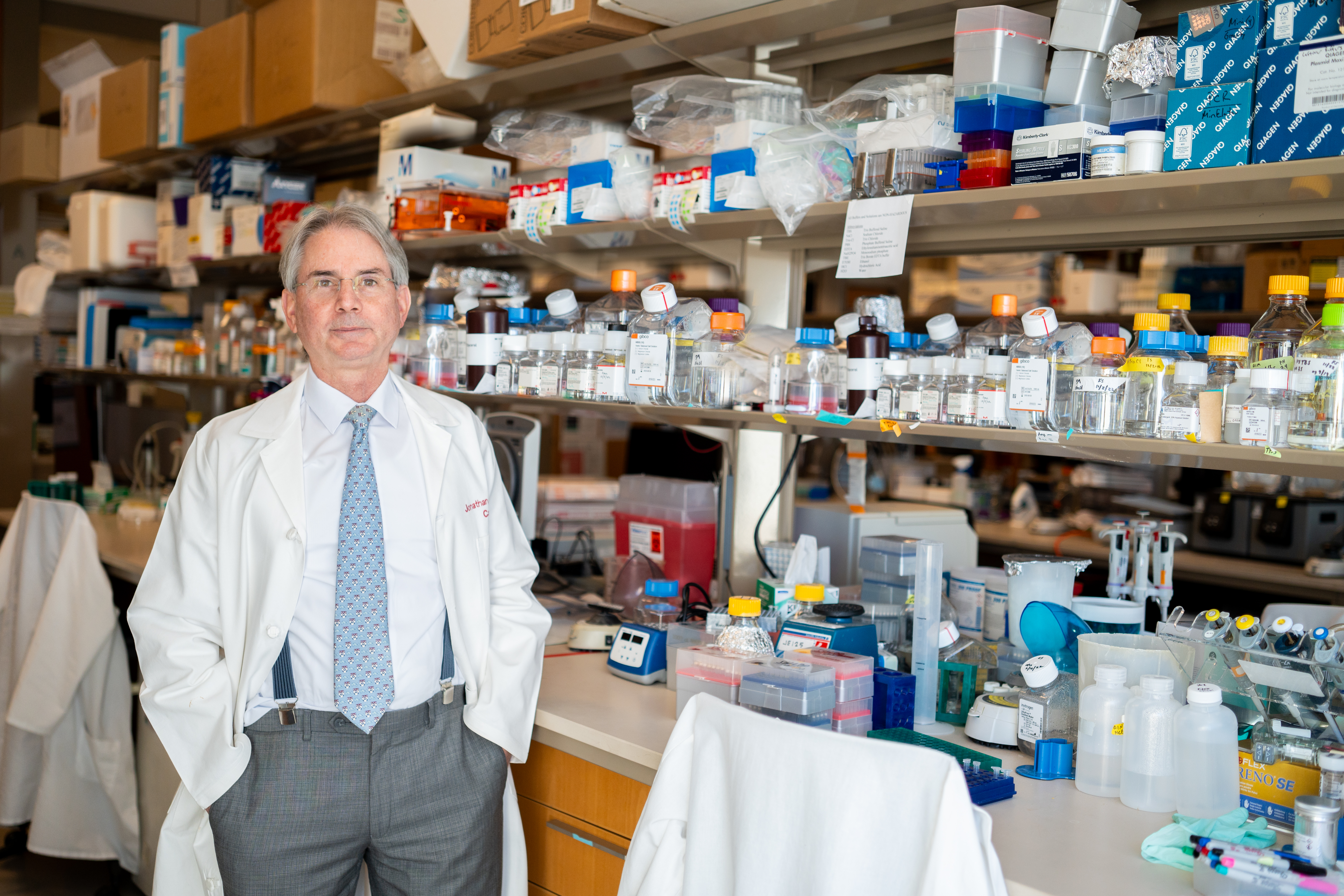 Jon Epstein in a white coat in his lab.