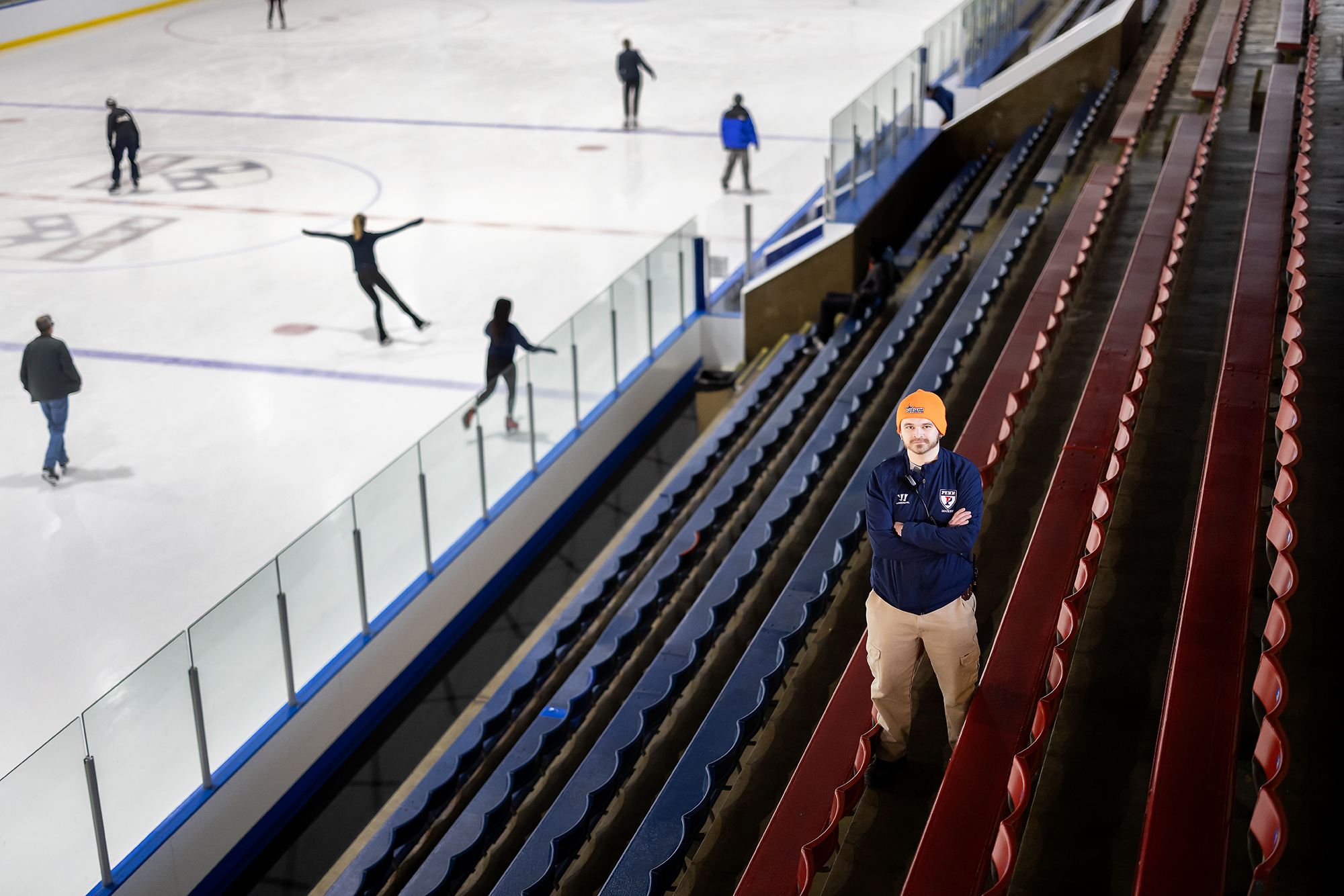 Mike Petrocelli stands in the bleachers at the Penn Ice Rink.