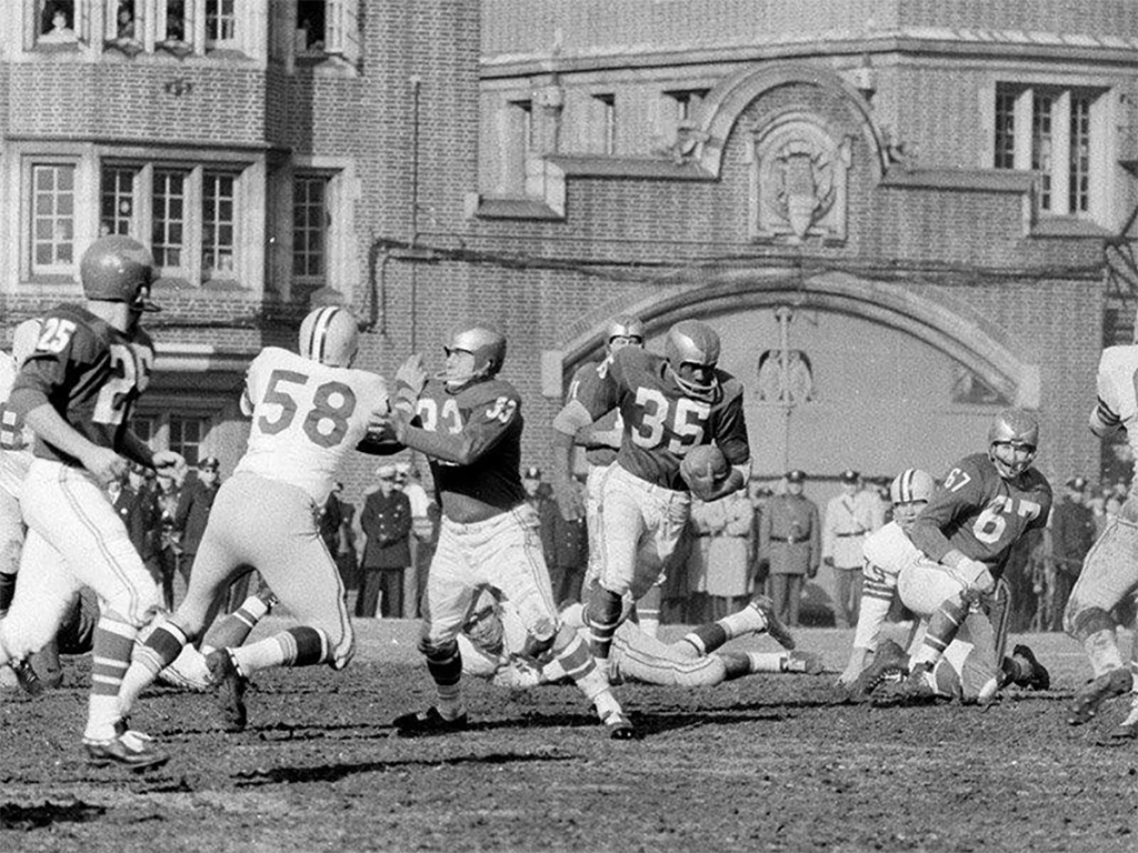 Eagles rookie running back and returner Ted Dean bursts through Packers defenders during the 1960 NFL Championship Game at Franklin Field.