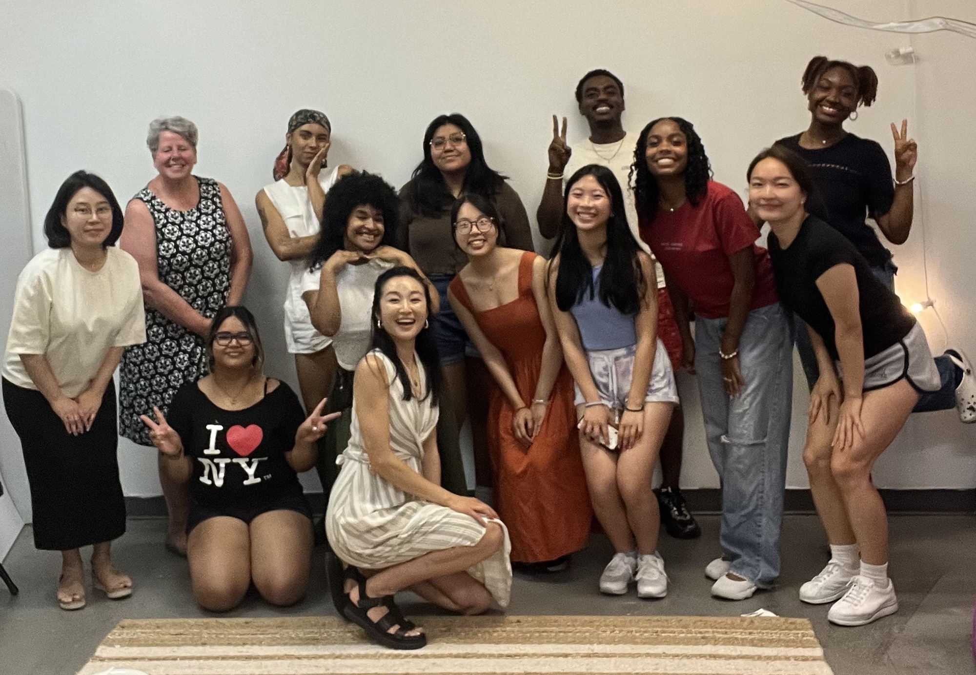 Youth posing and smiling in a group photo.