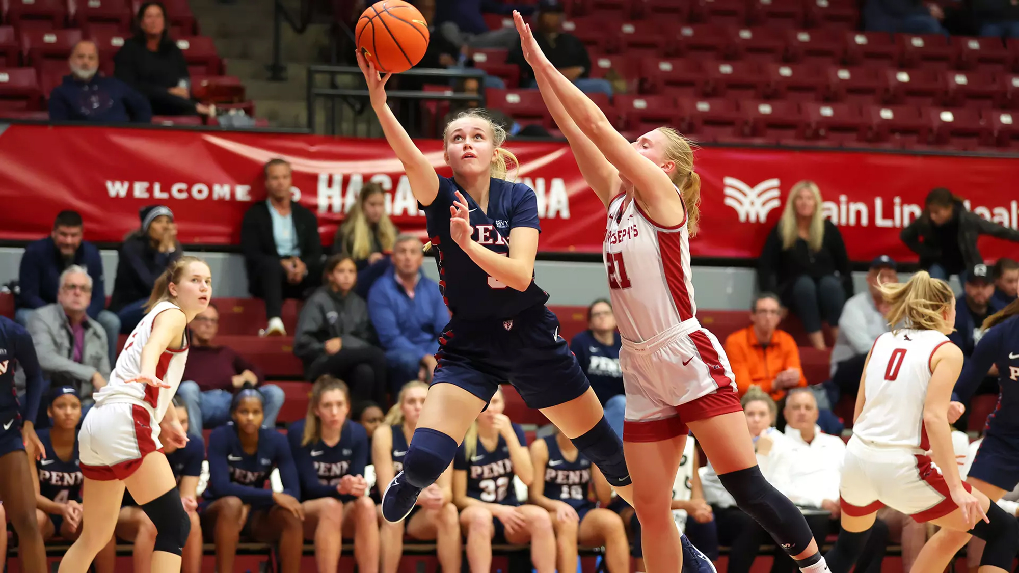 Stina Almqvist shoots a layup during an away game.