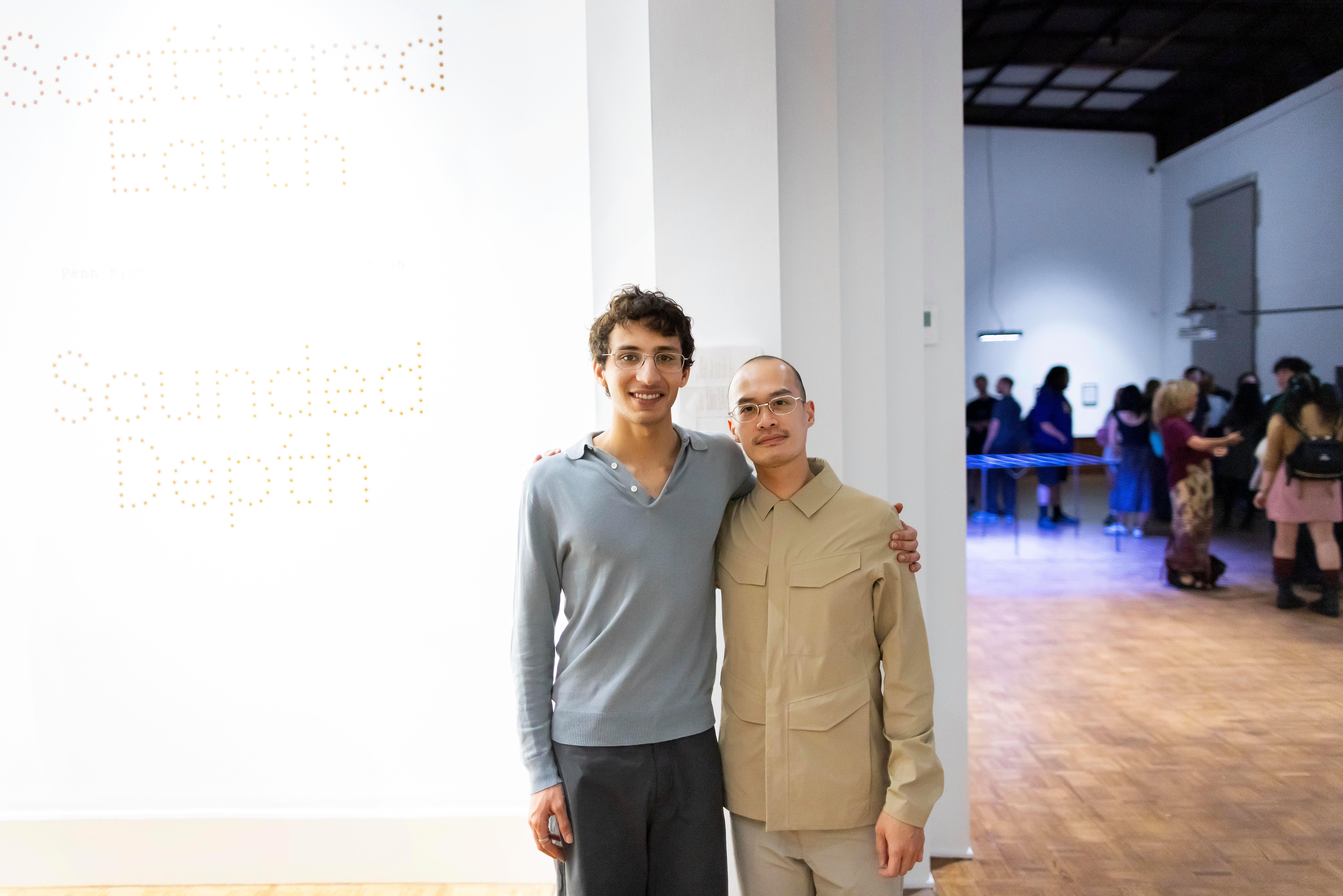  Eissa Attar and Alvin Luong standing in gallery